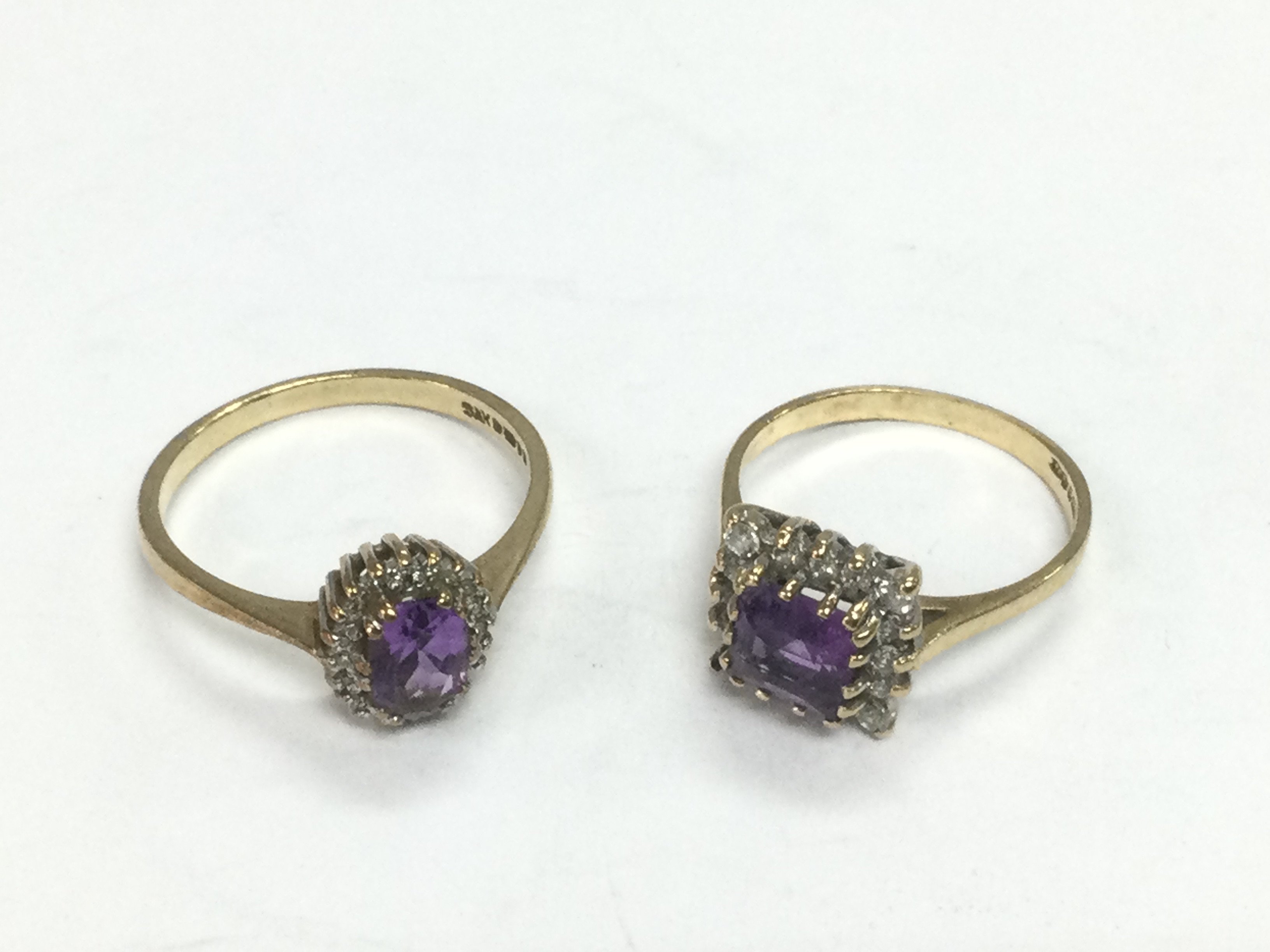 Two 9ct gold rings set with diamonds and amethyst, approx sizes P and L. Total approx 4.4g. Shipping category A.