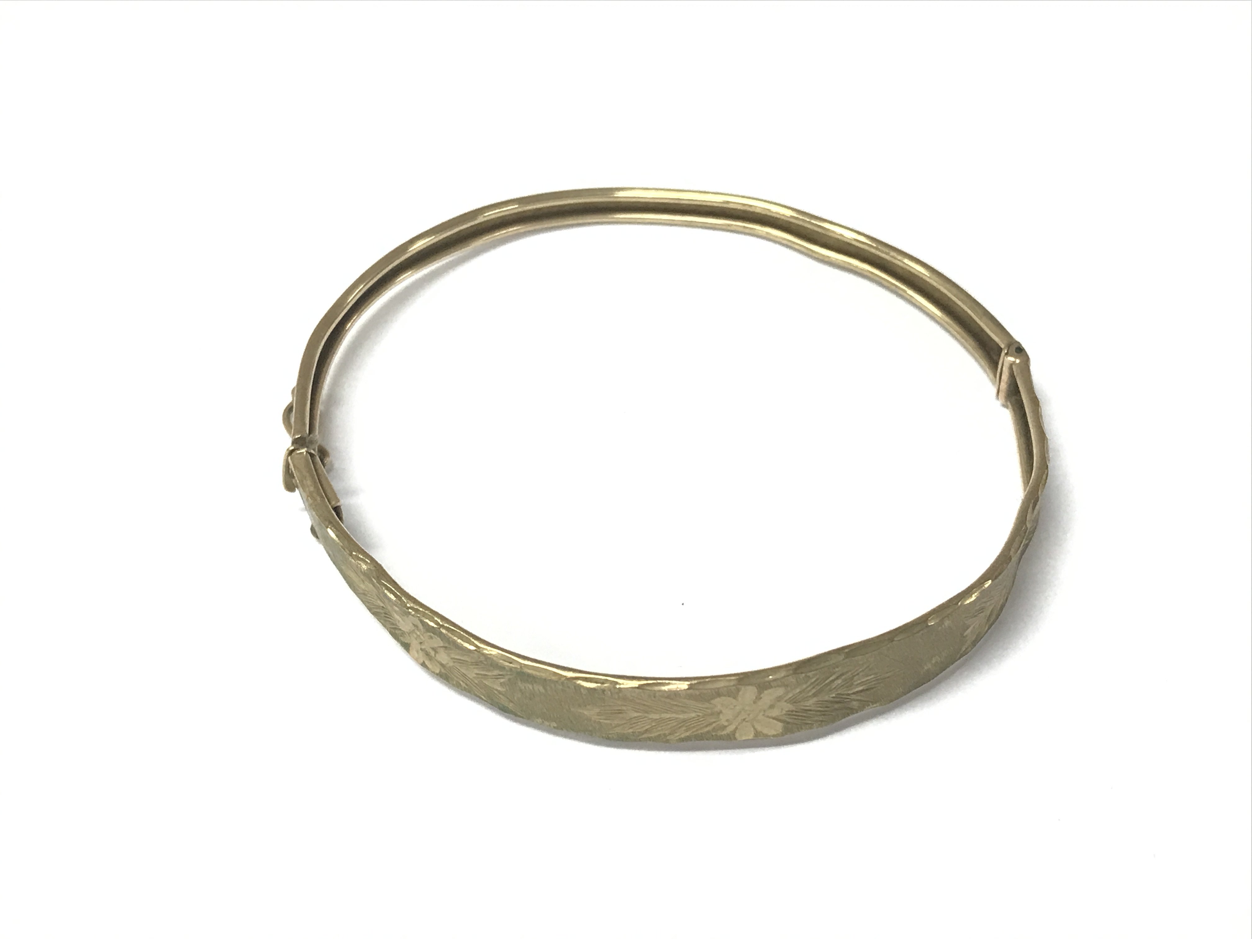 A 9ct gold bangle. 5.48g Postage A