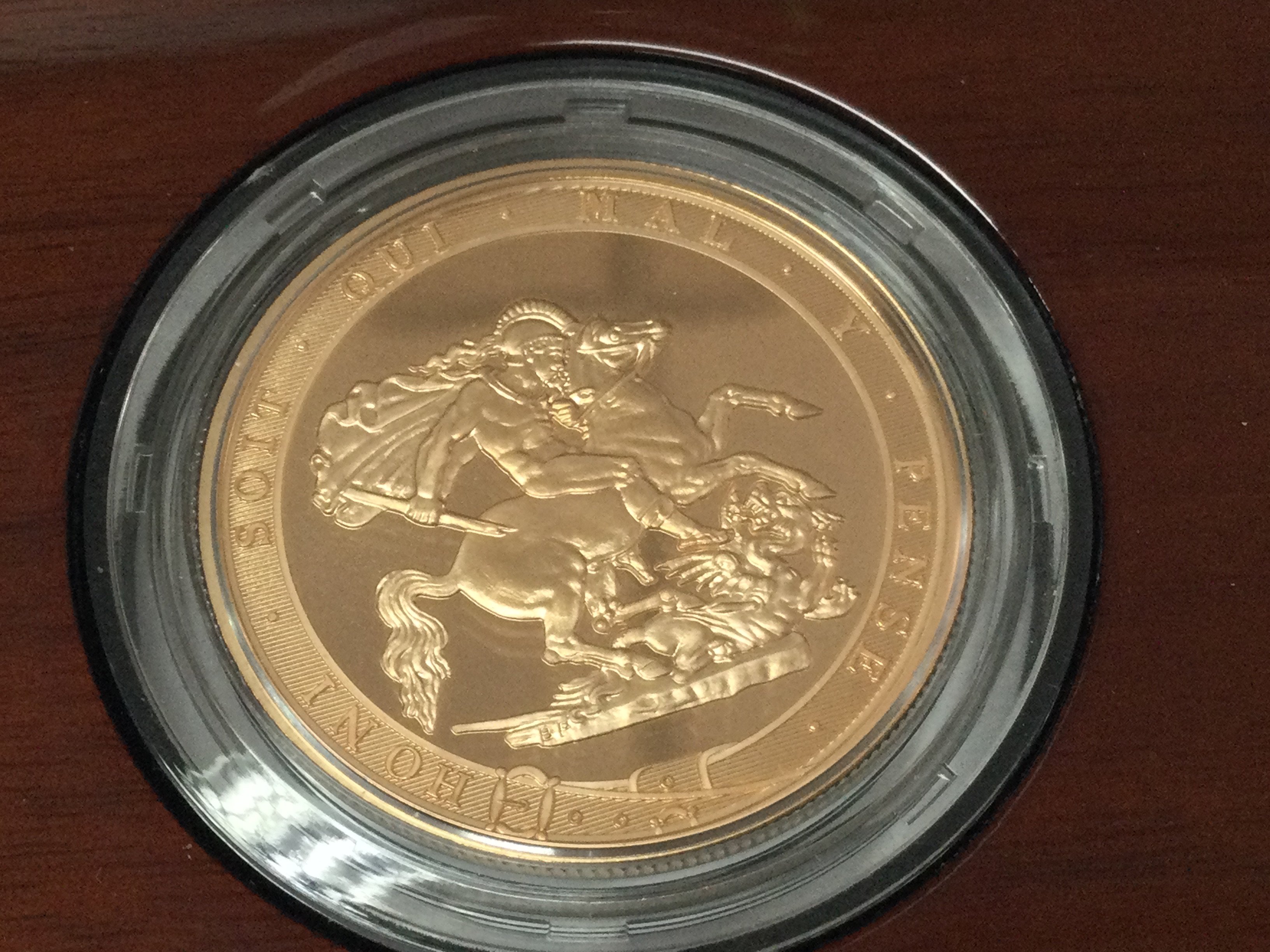 A 2017 five sovereign piece brilliant uncirculated coin with COA.Postage B