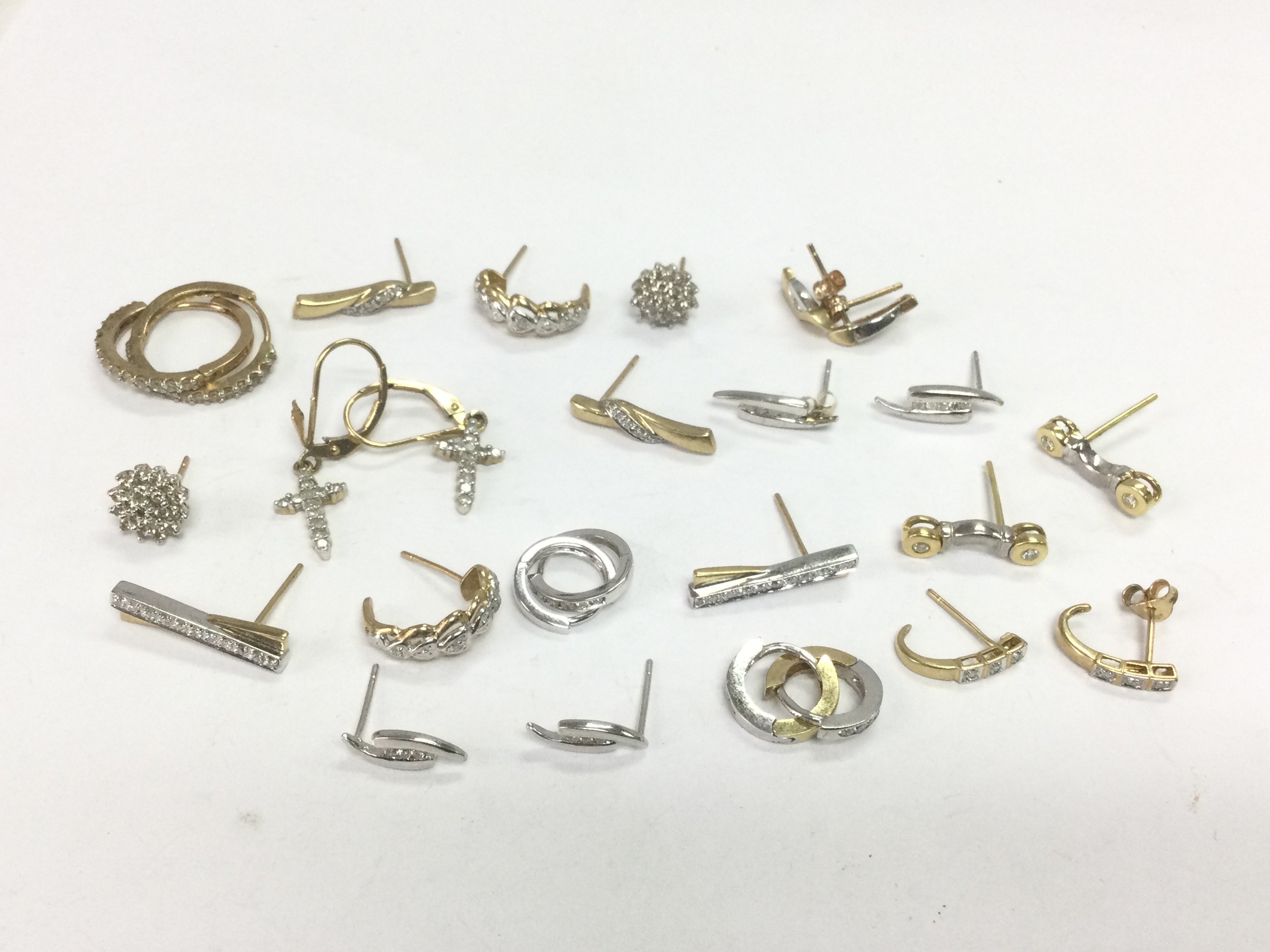 A collection of gold hoops and drop earrings set with diamonds, total approx 18.5g. Shipping category A.