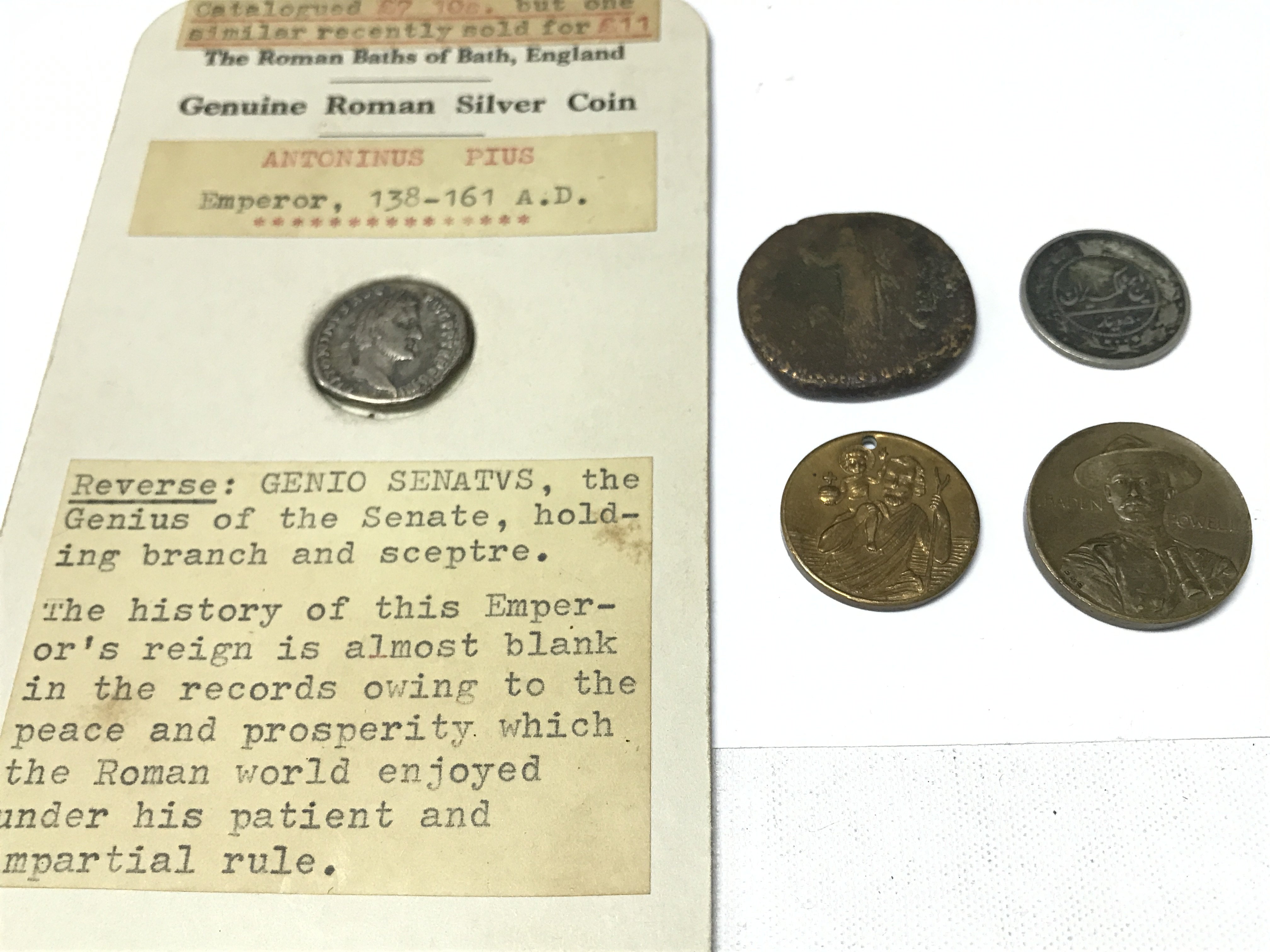 A small collection of coins including Roman Antoninus Pius 138-161 A.D coin. Postage category A