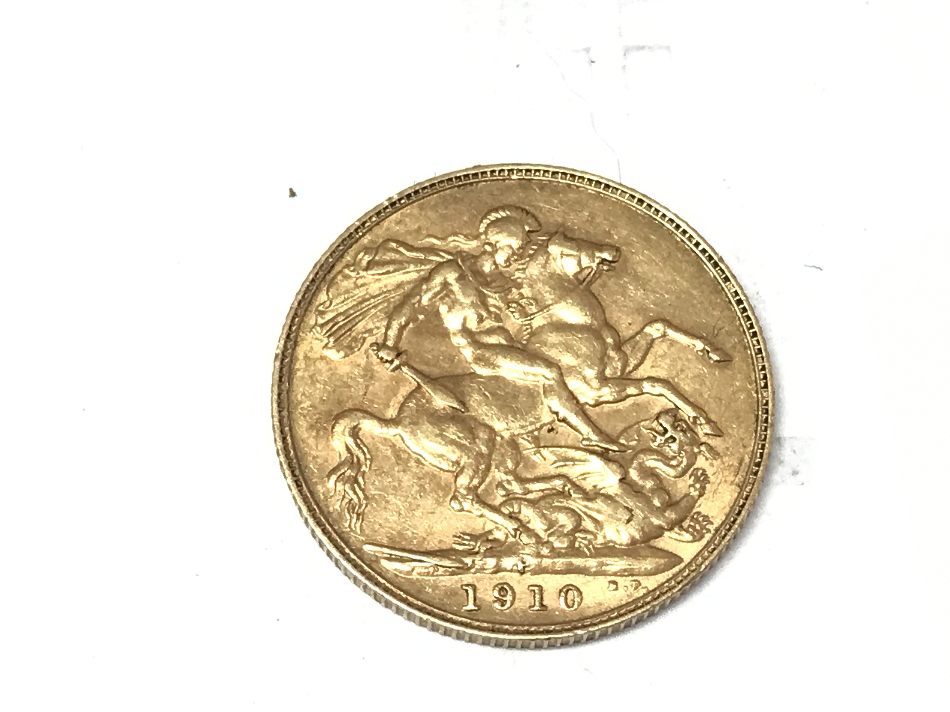 A 1910 full sovereign Perth mint mark. Postage A