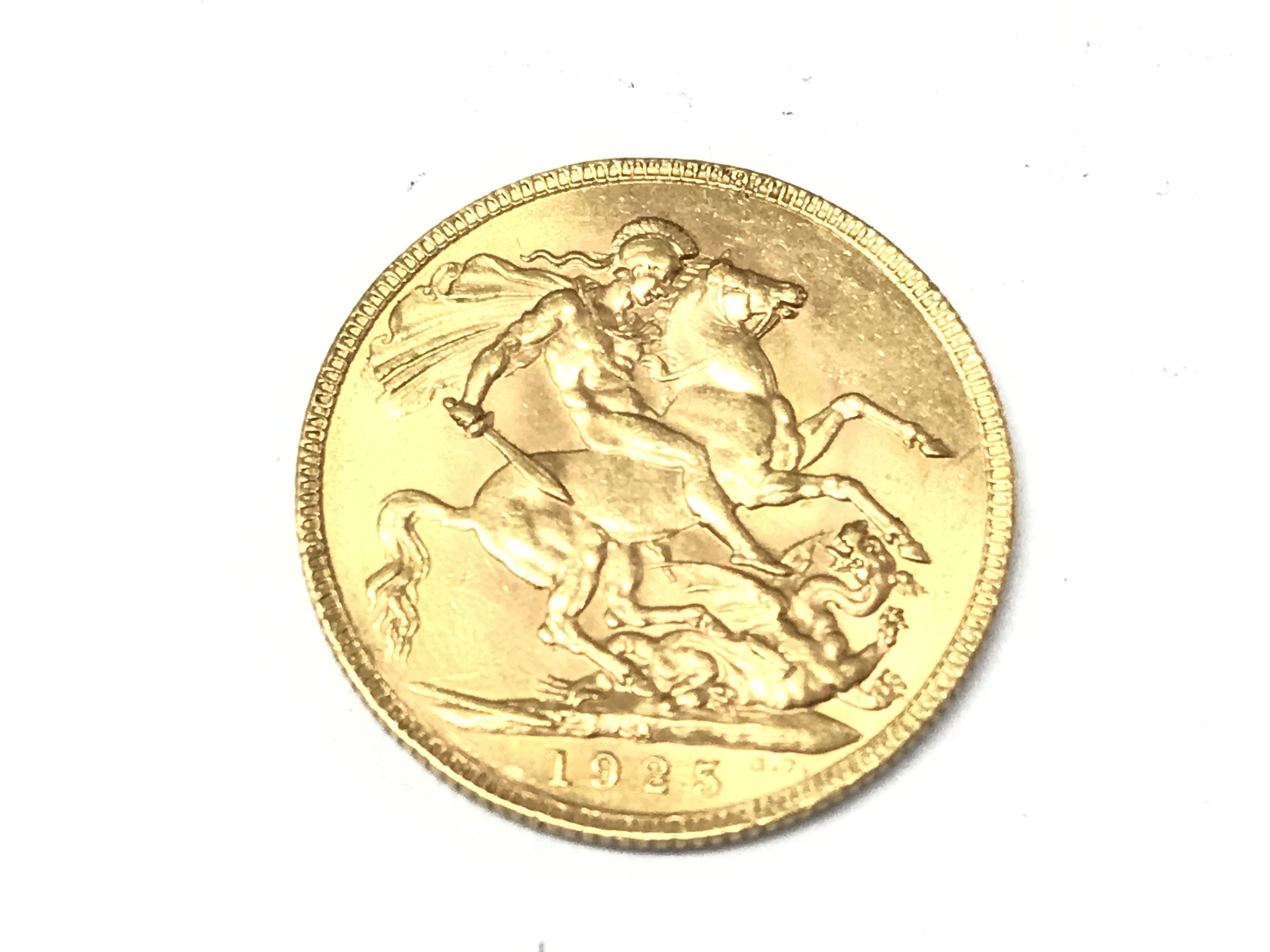A 1925 full sovereign with South Africa mint mark. Postage A