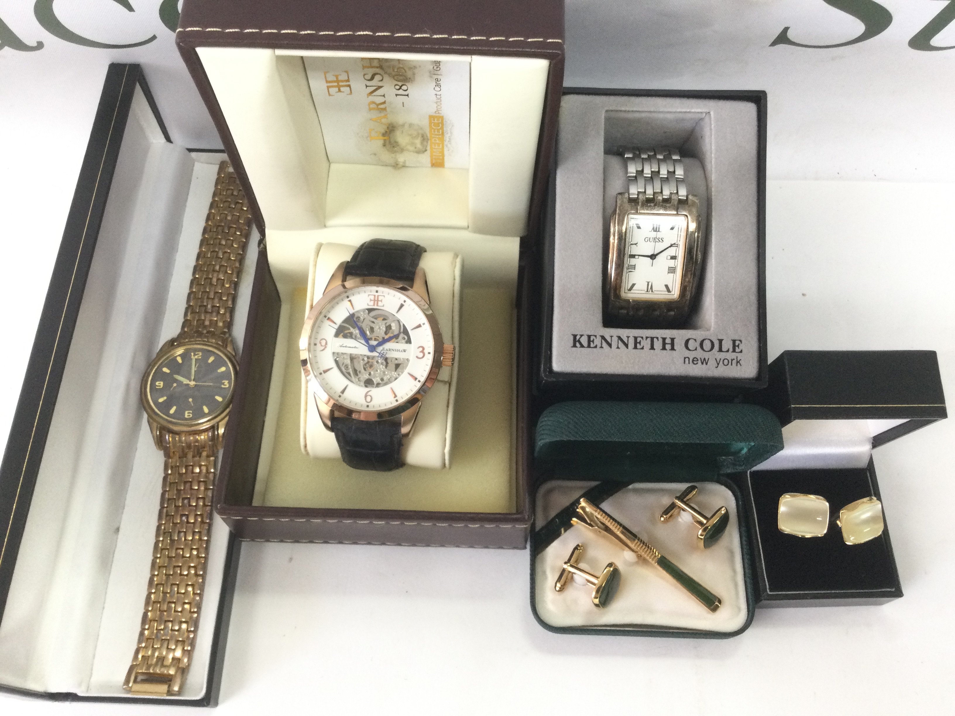 Three fashion watches and two pairs of cufflinks. Shipping category B.