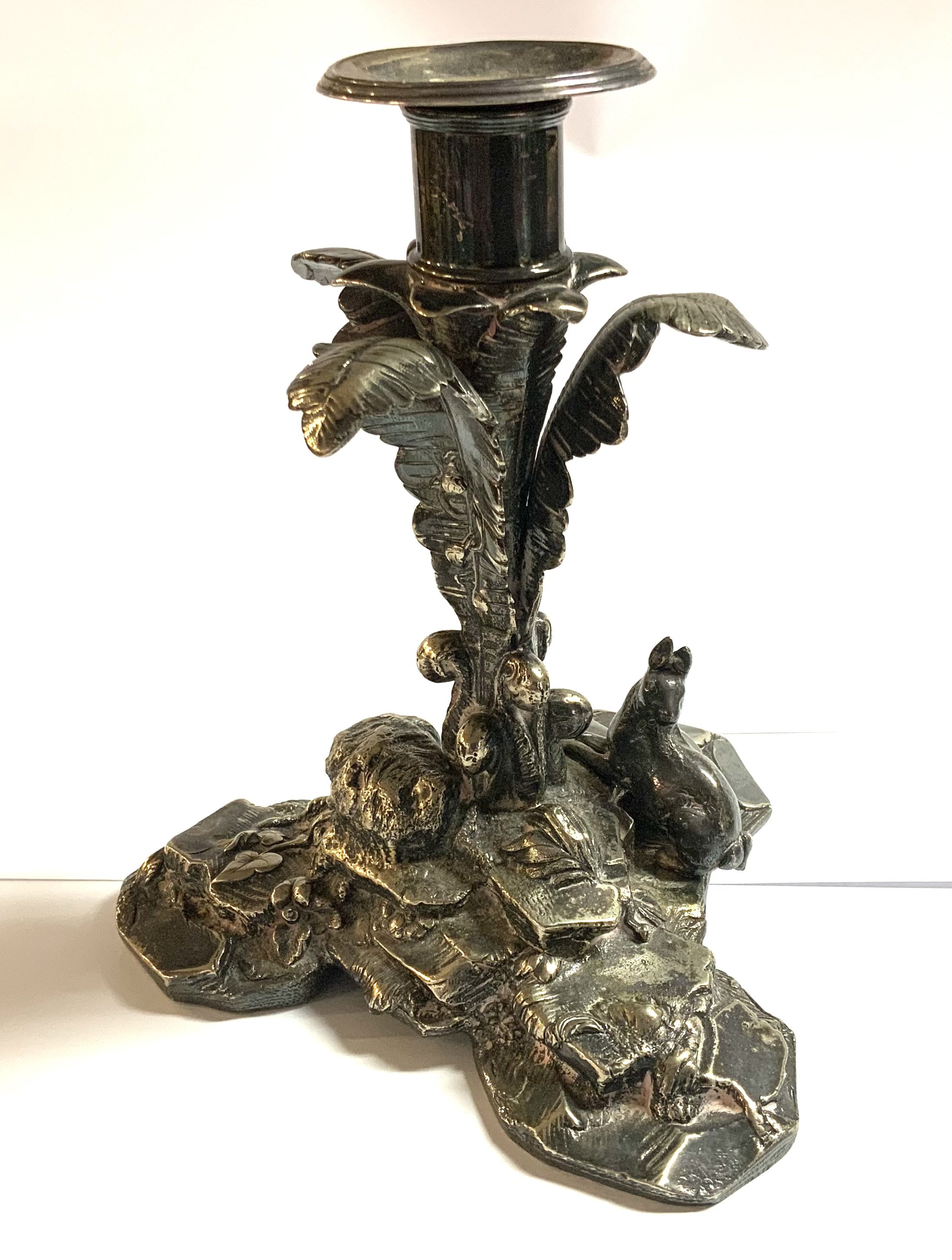 A good quality silver plated candlestick with ferns and rabbits. 17cm.