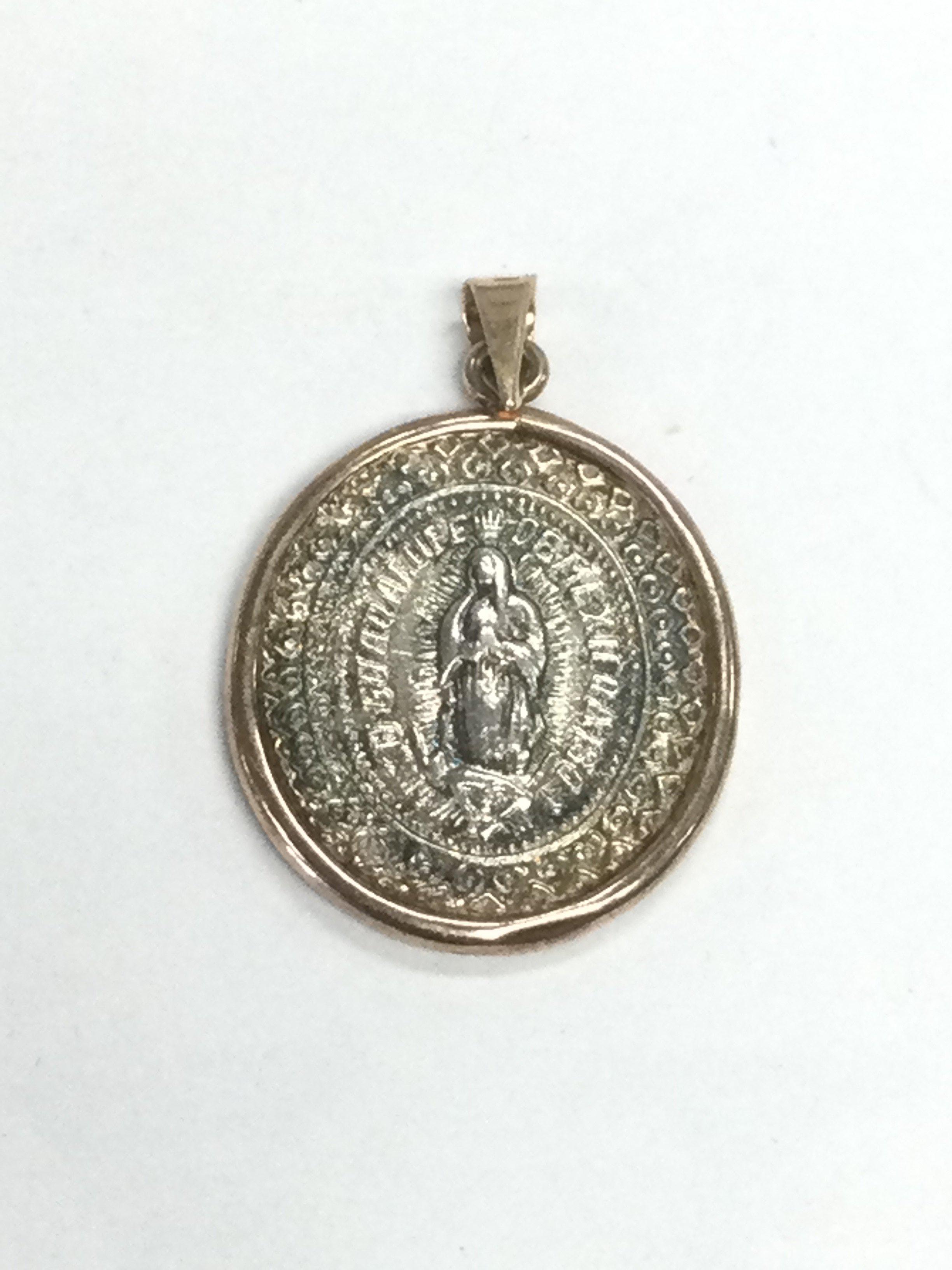 An 1807 gold and silver pendant, approx length 3cm. Shipping category A.