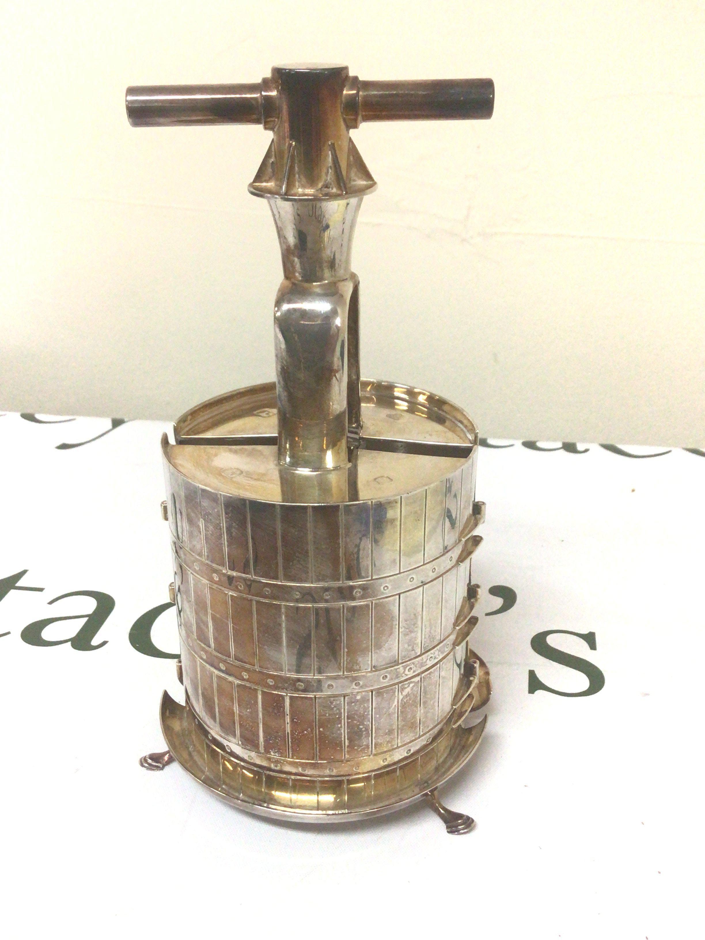 A Bispoke and unique silver corkscrew in the form of a barrel London hallmarks weight 800g approximately the lower edge with personal inscription. Height 21cm.