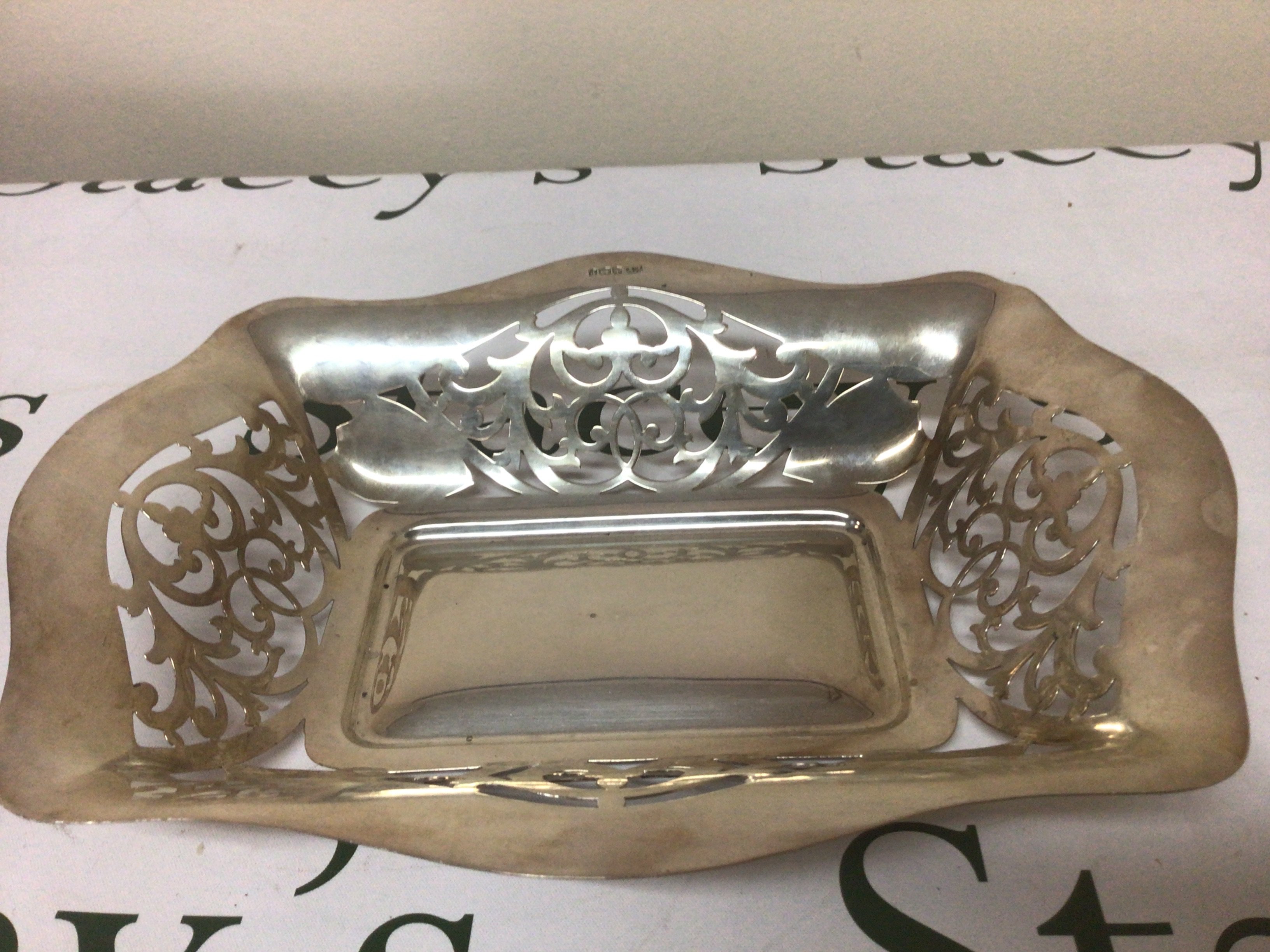 A silver dish with pierced shape sides Sheffield hallmarks maker EV. 28x22cm. Weight 366g.