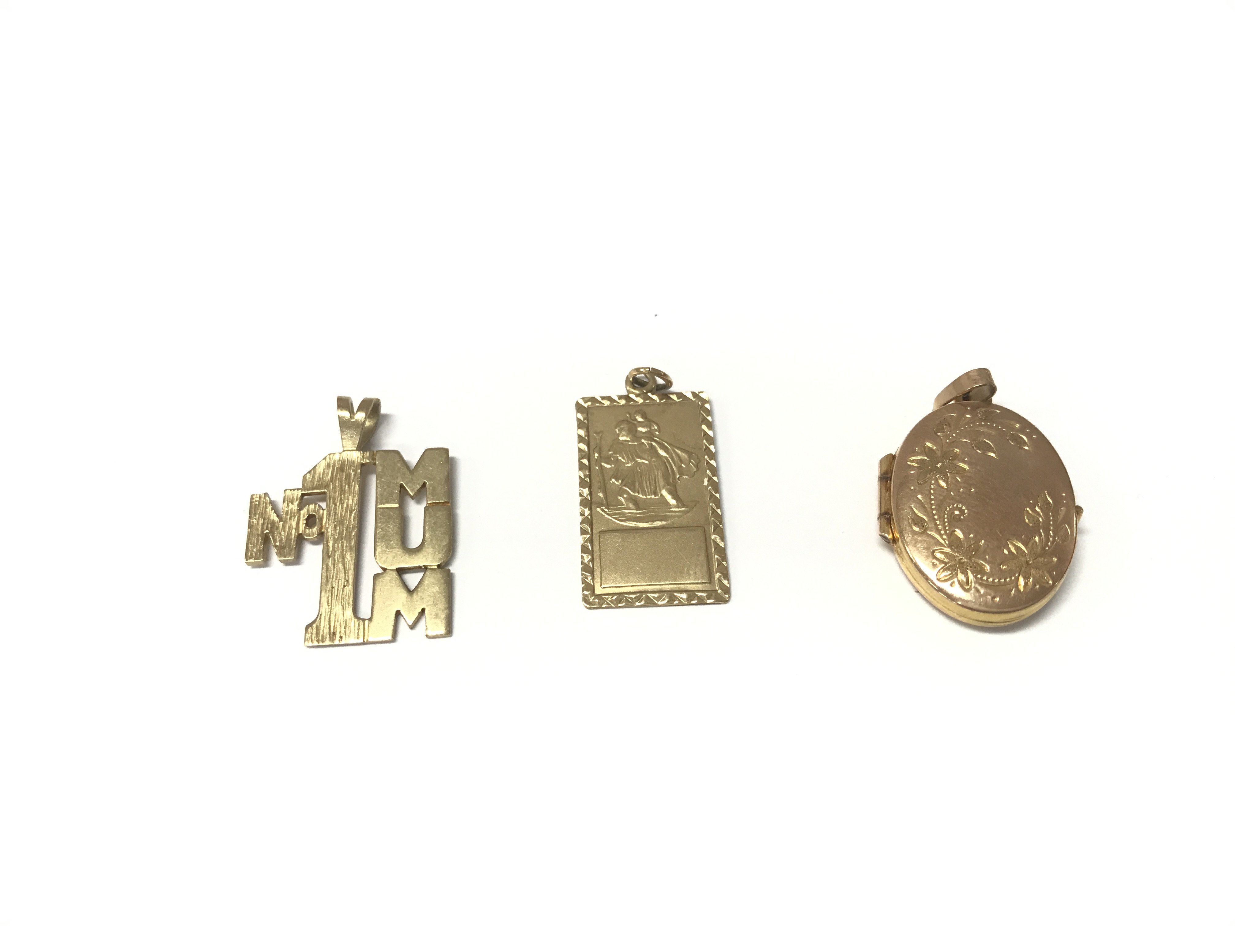 Two 9ct gold pendants and a 9ct gold locket. 6.39g