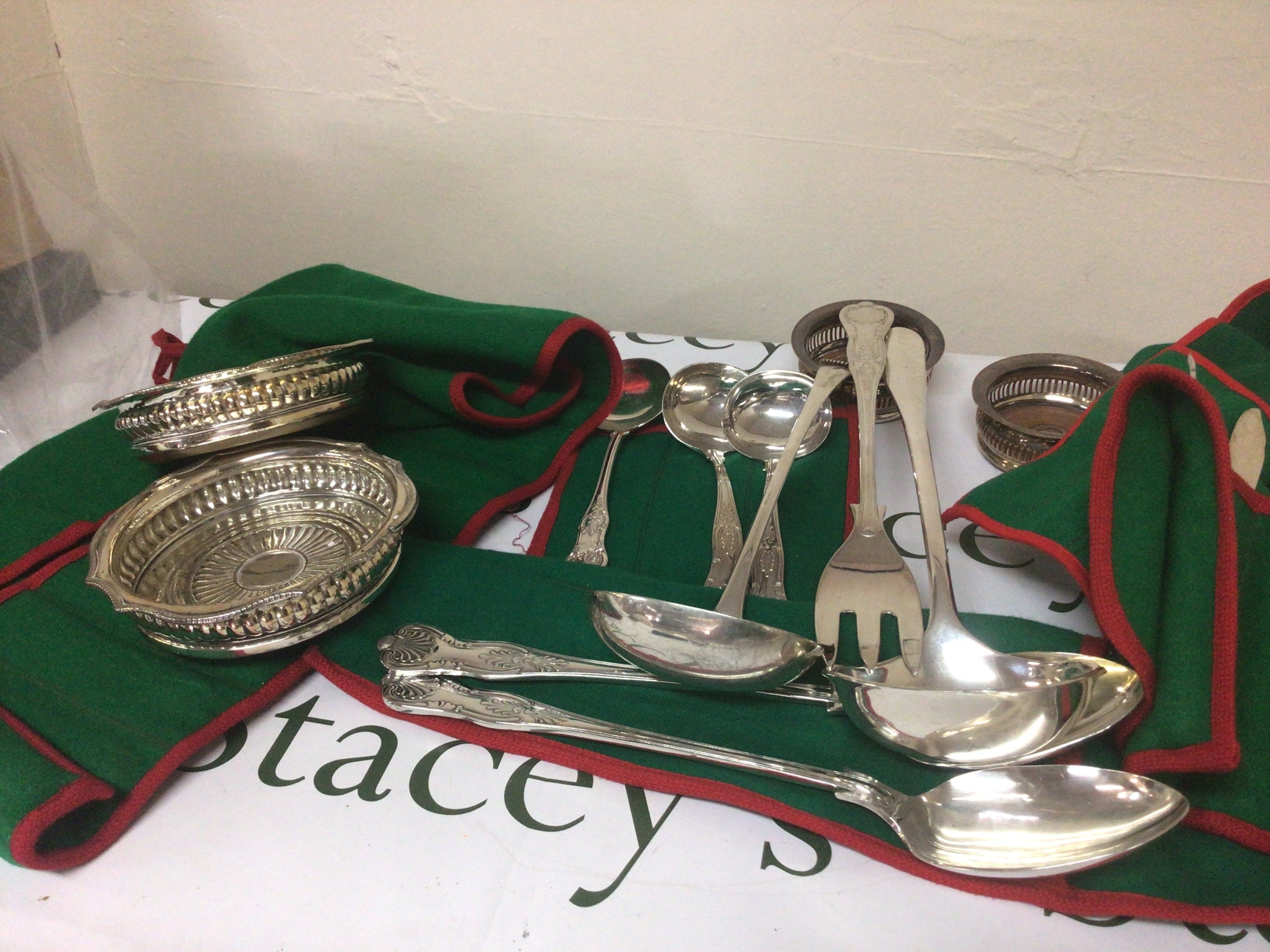 A box containing a large quantity of good quality silver plated cutlery including serving spoons wine coasters other cutlery tureens plates etc.