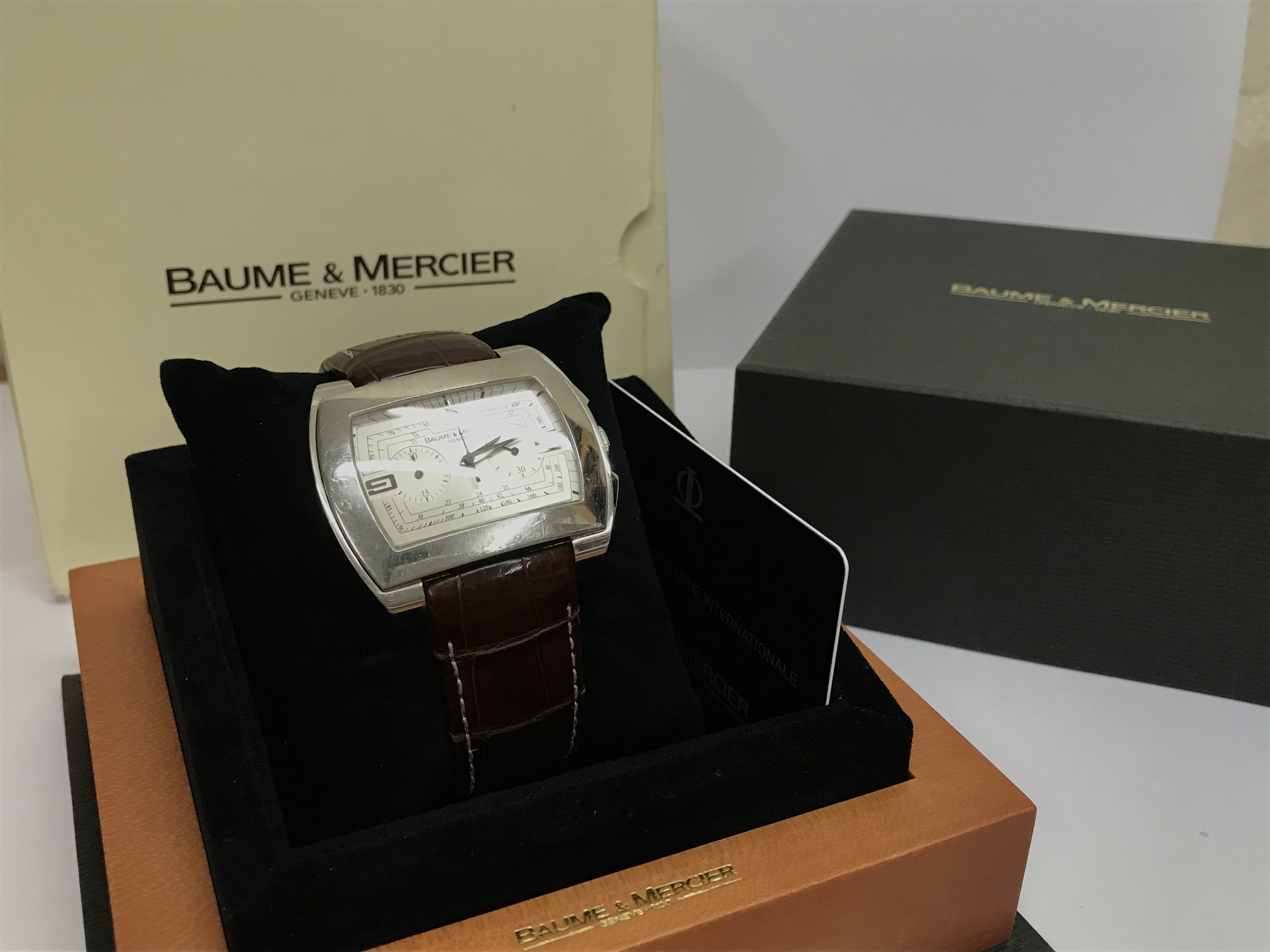 A Boxed Baume & Mercier Hampton automatic Chronograph watch . Postage cat B