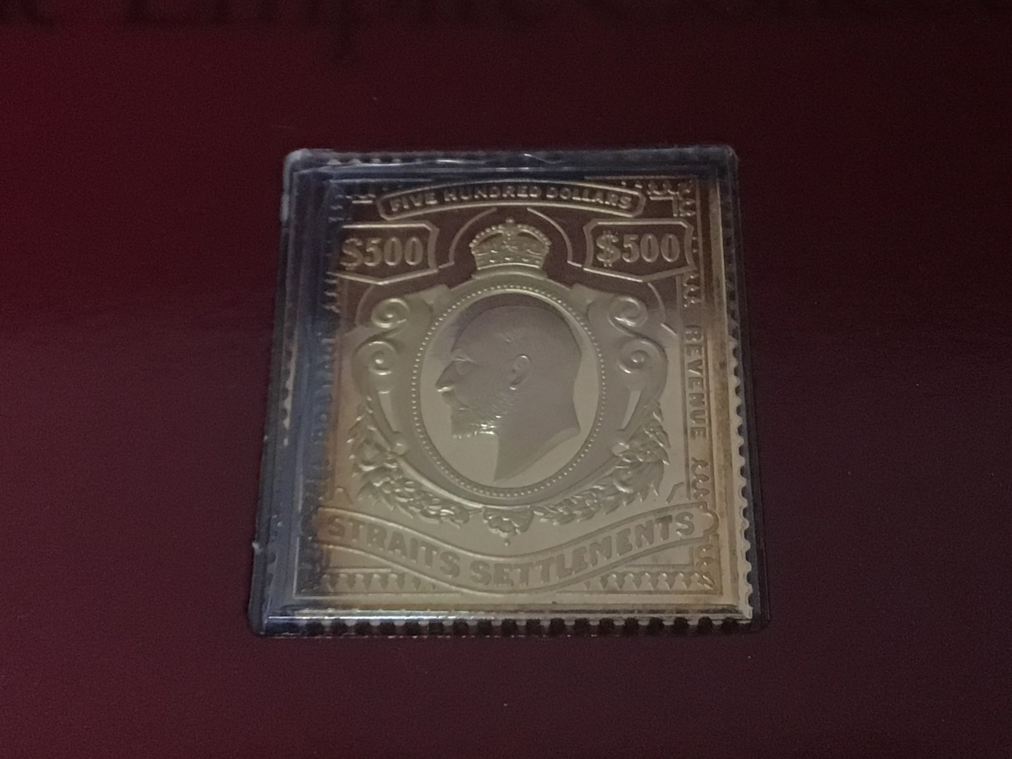 A collection of silver gilt Hallmarked Replica stamps The Empire collection 25 stamps in original packaging sold with a presentation fitted box.