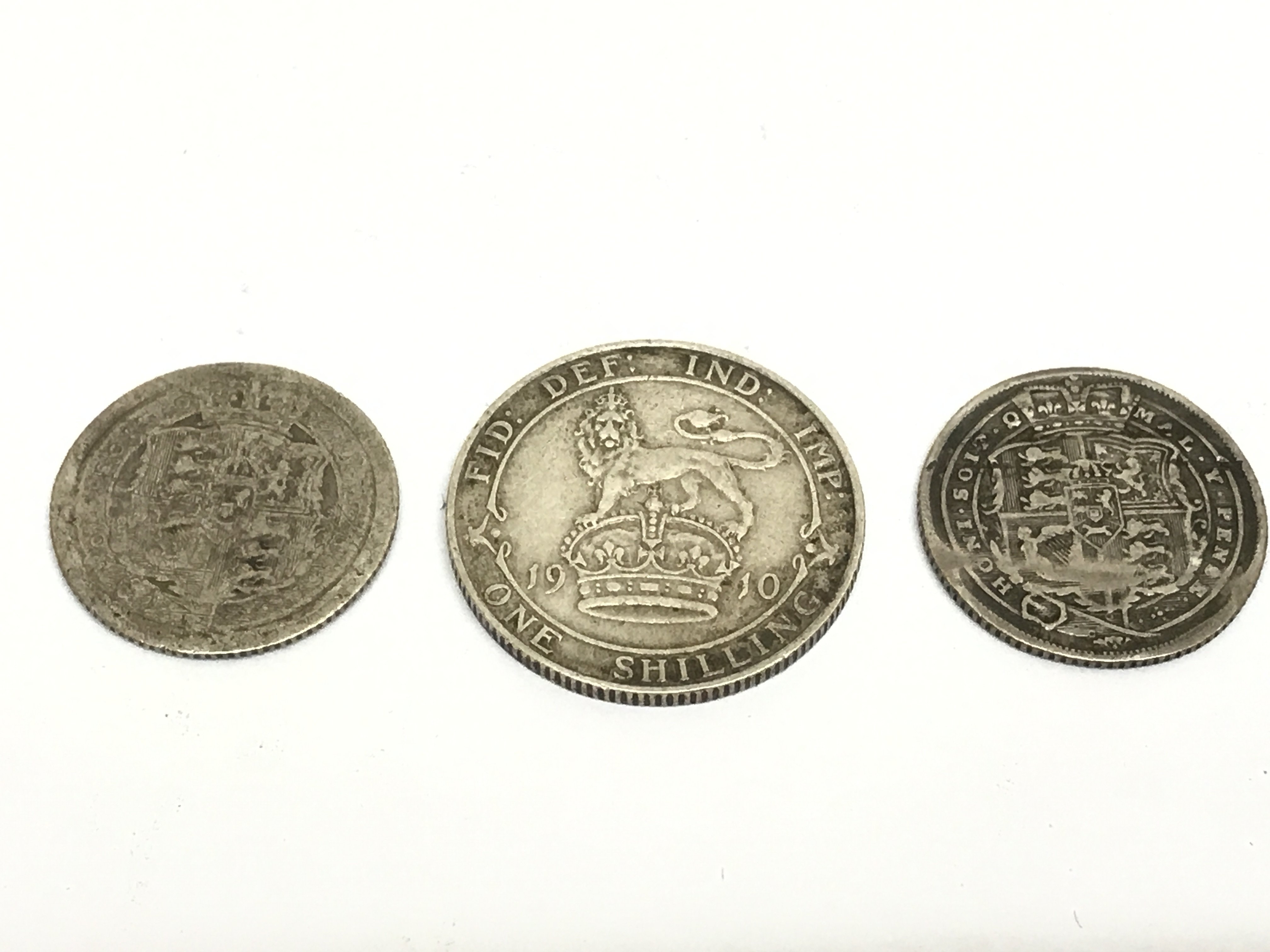 A 1910 shilling, 1816 six piece and another six pence . Postage category A