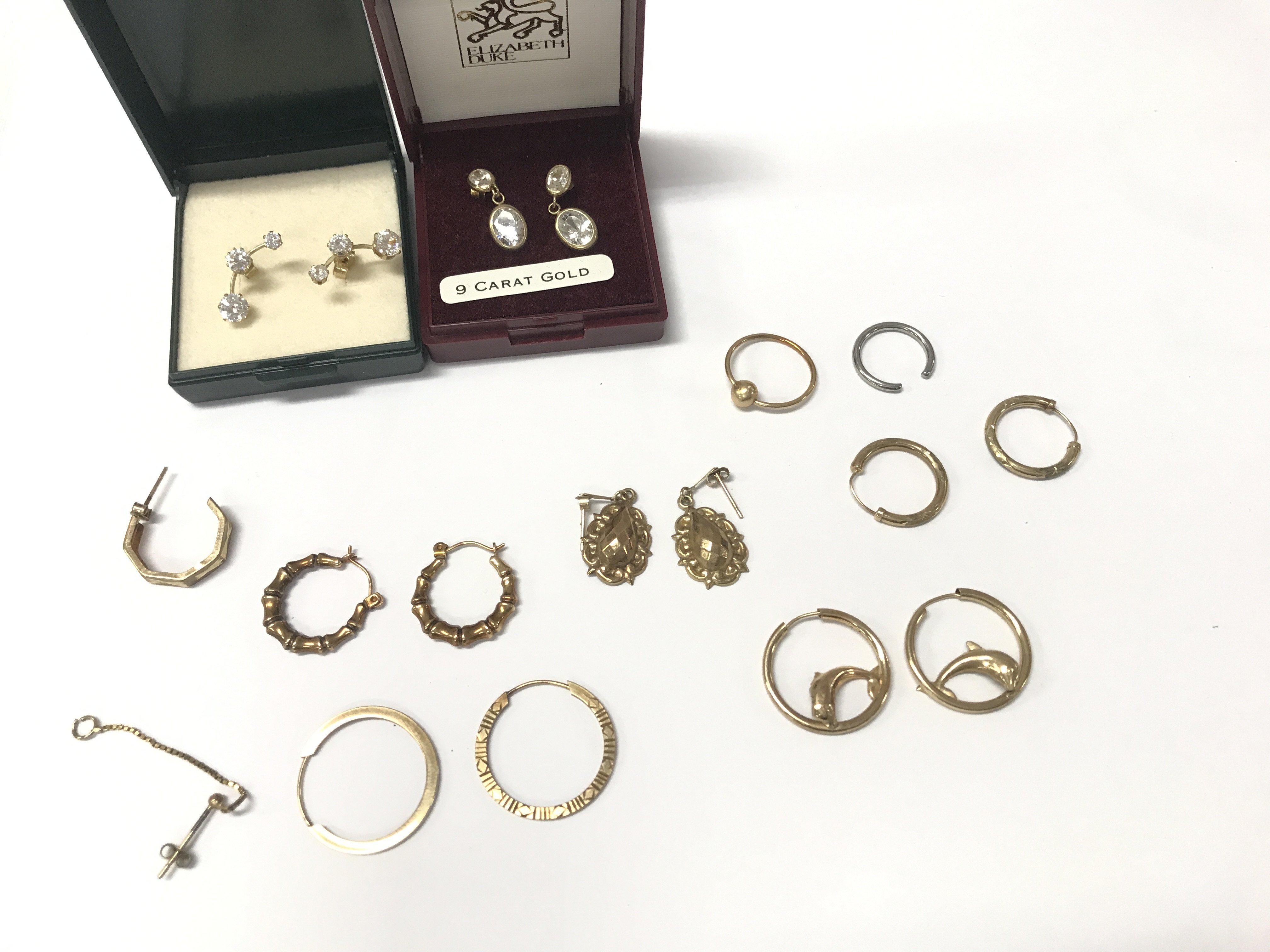 A collection of 9ct gold and yellow metal earrings. Postage B