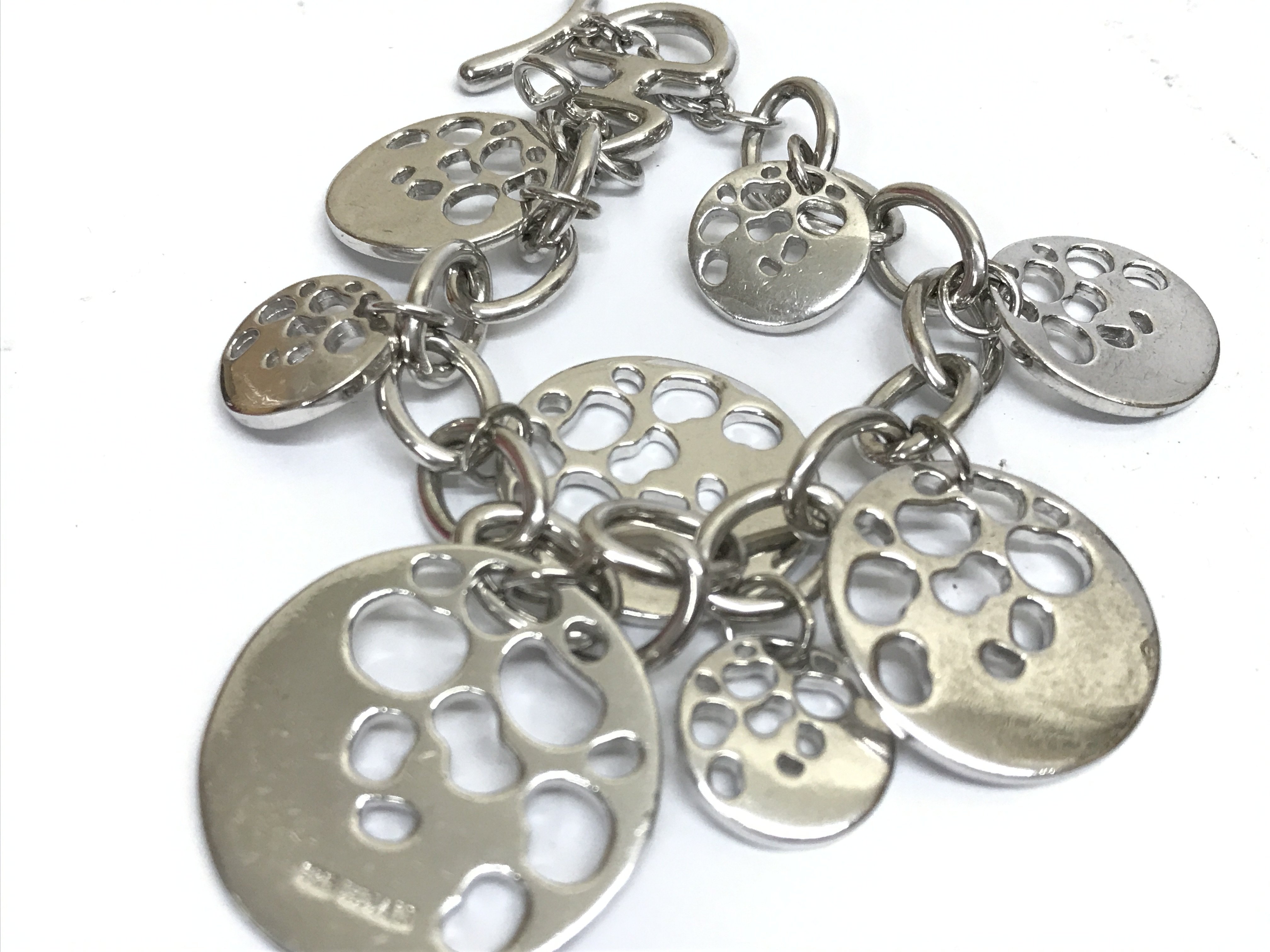 A sterling and diamond set HDIA/N bracelet . Postage category A