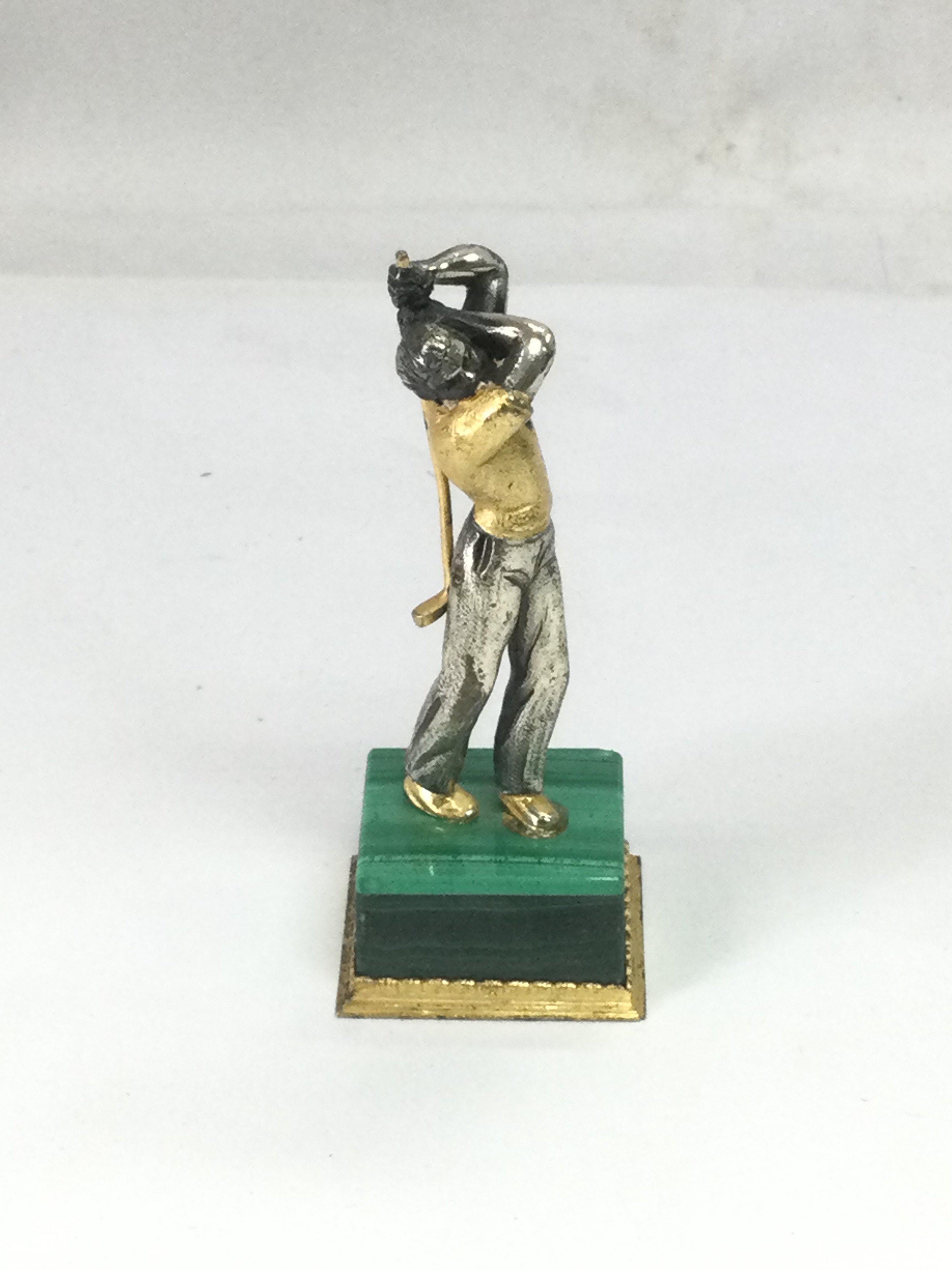A small silver gilt figure of a golfer, approx height 8cm. Shipping category B.