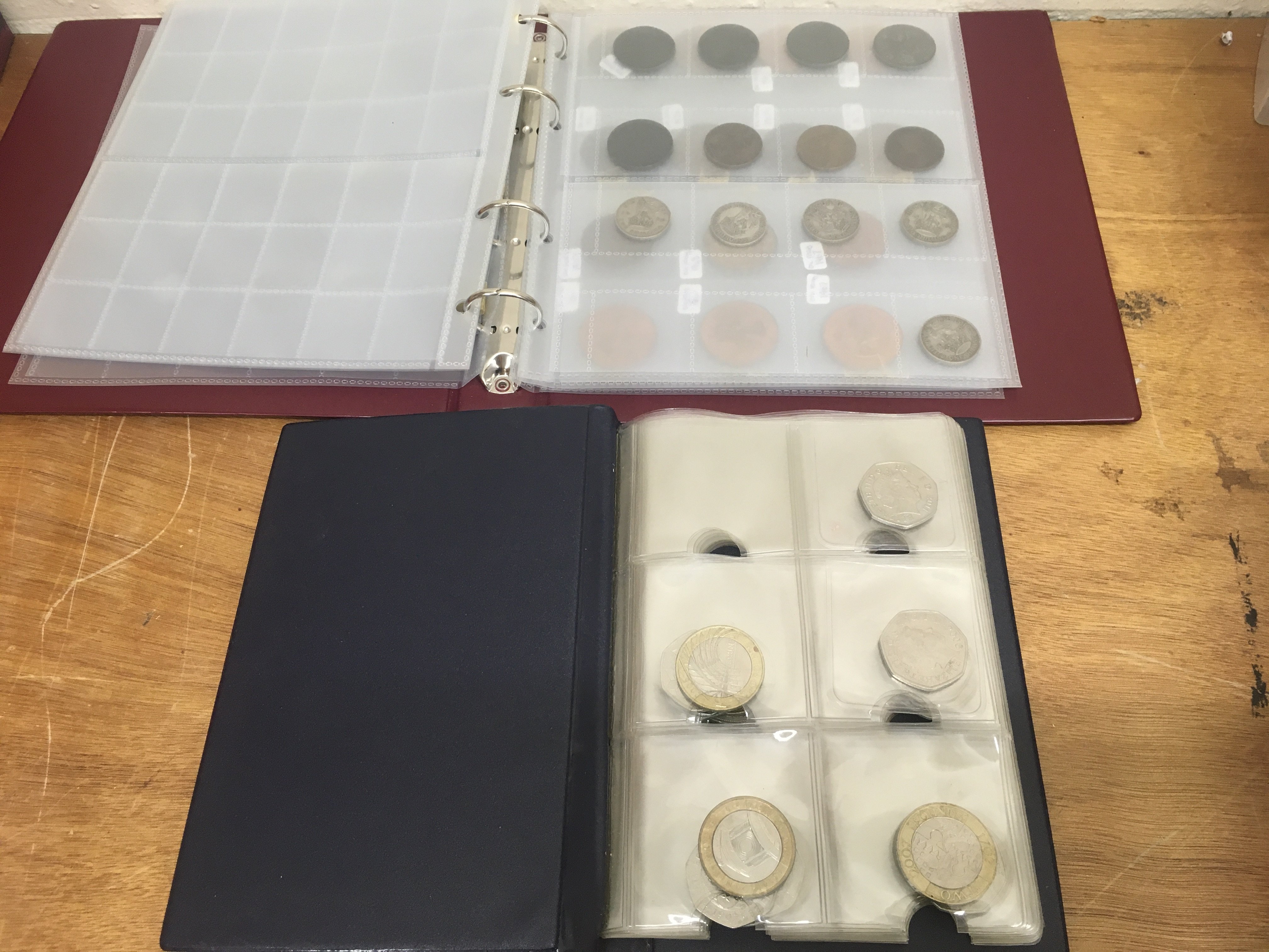 A collection of British and world coins including two pound coins, American quarter dollars, 2 sen coin, Shillings, pennies Etc . Postage category B