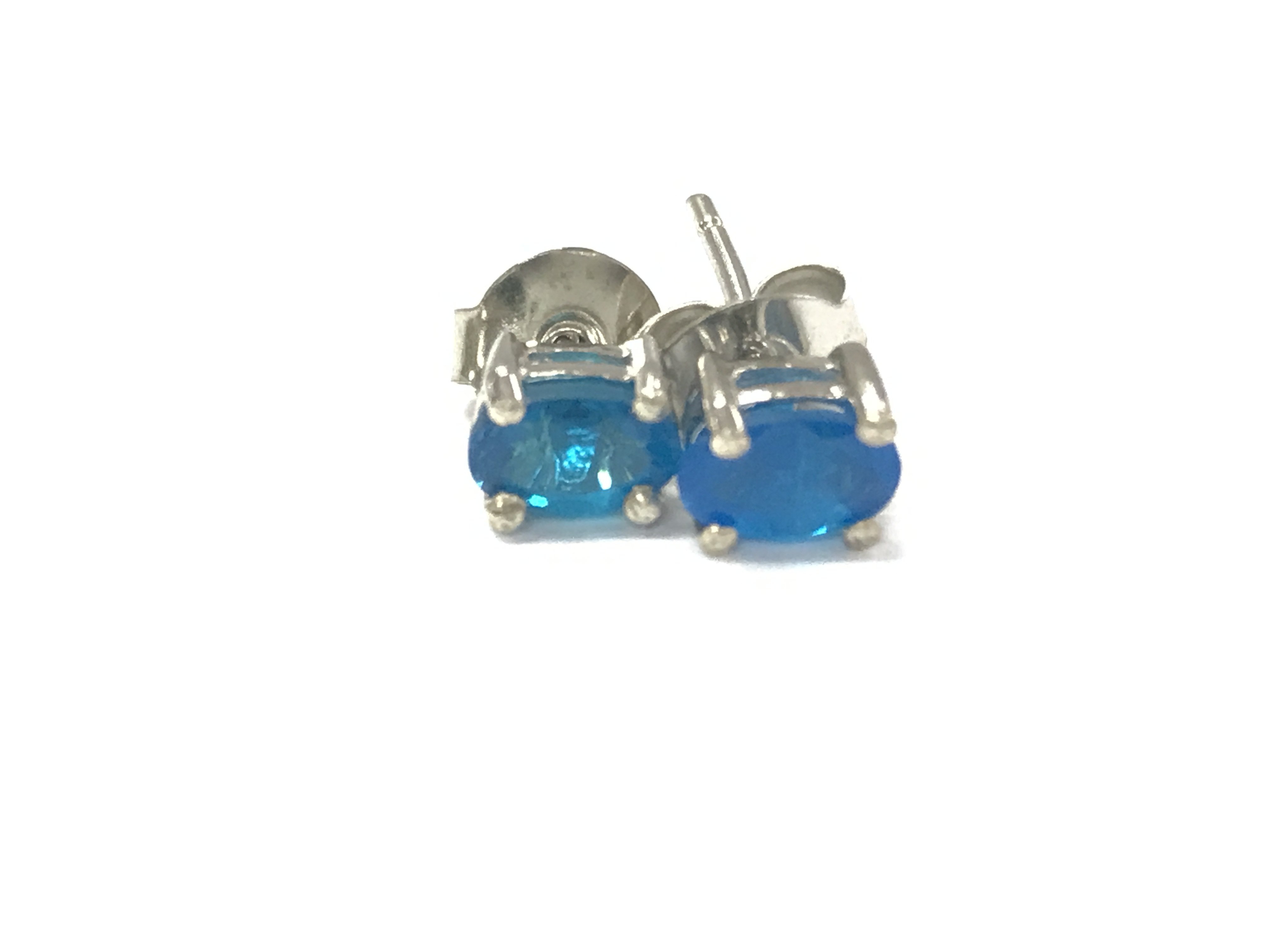 A pair of neon apatite studs in silver. Postage A