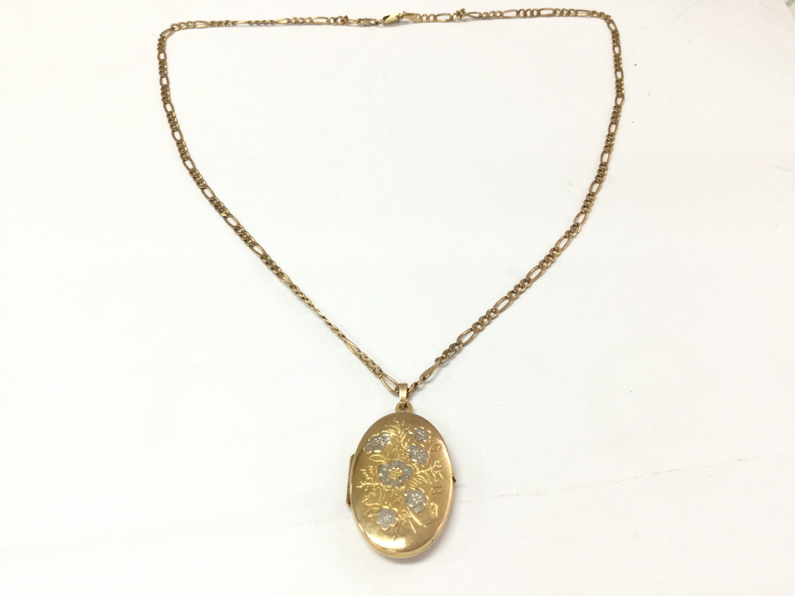 A 9ct gold chain and 9ct locket. 12.33g Postage B
