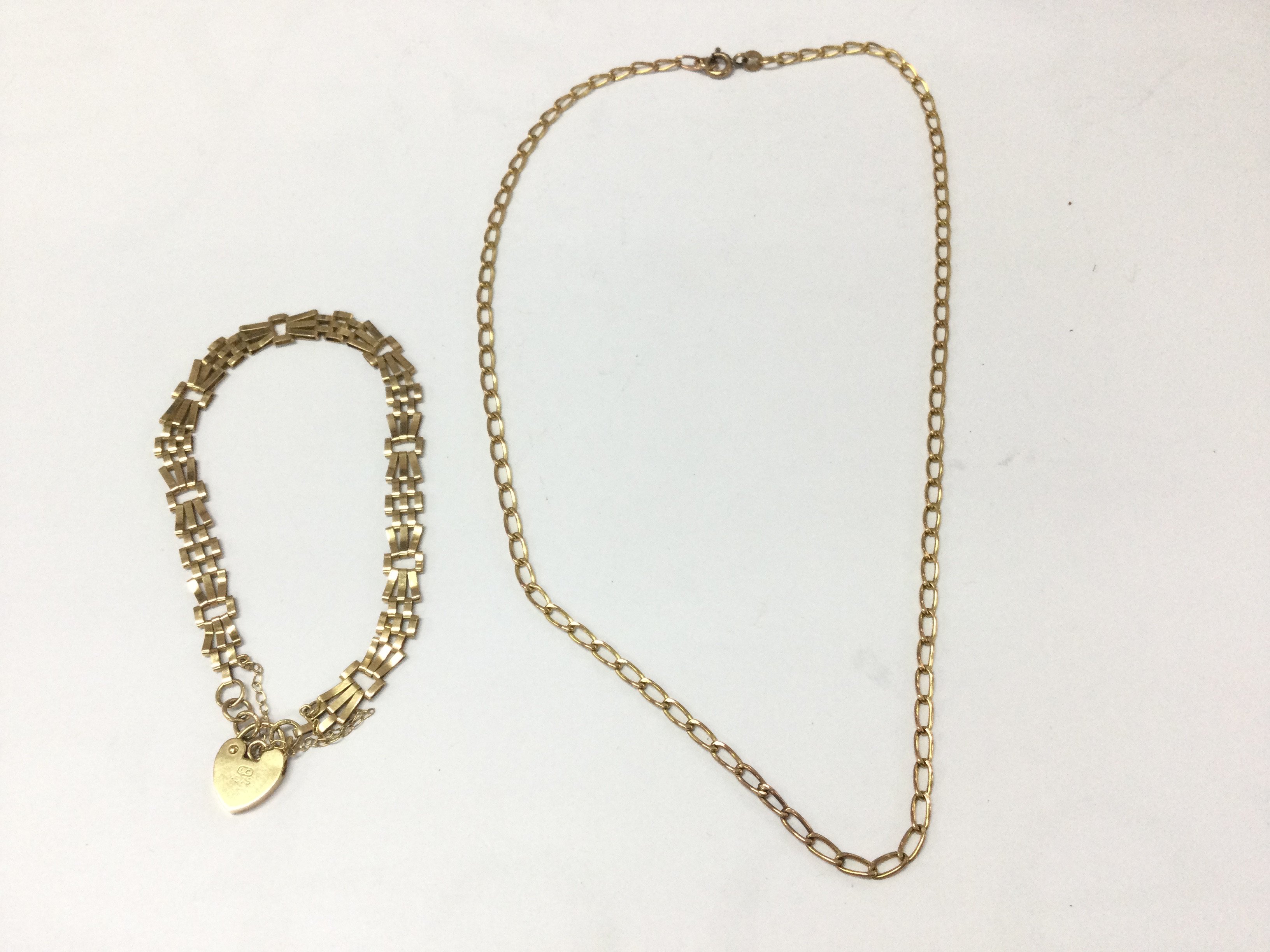 A 9ct gold gate bracelet and a 9ct gold chain. 6.57g Postage A