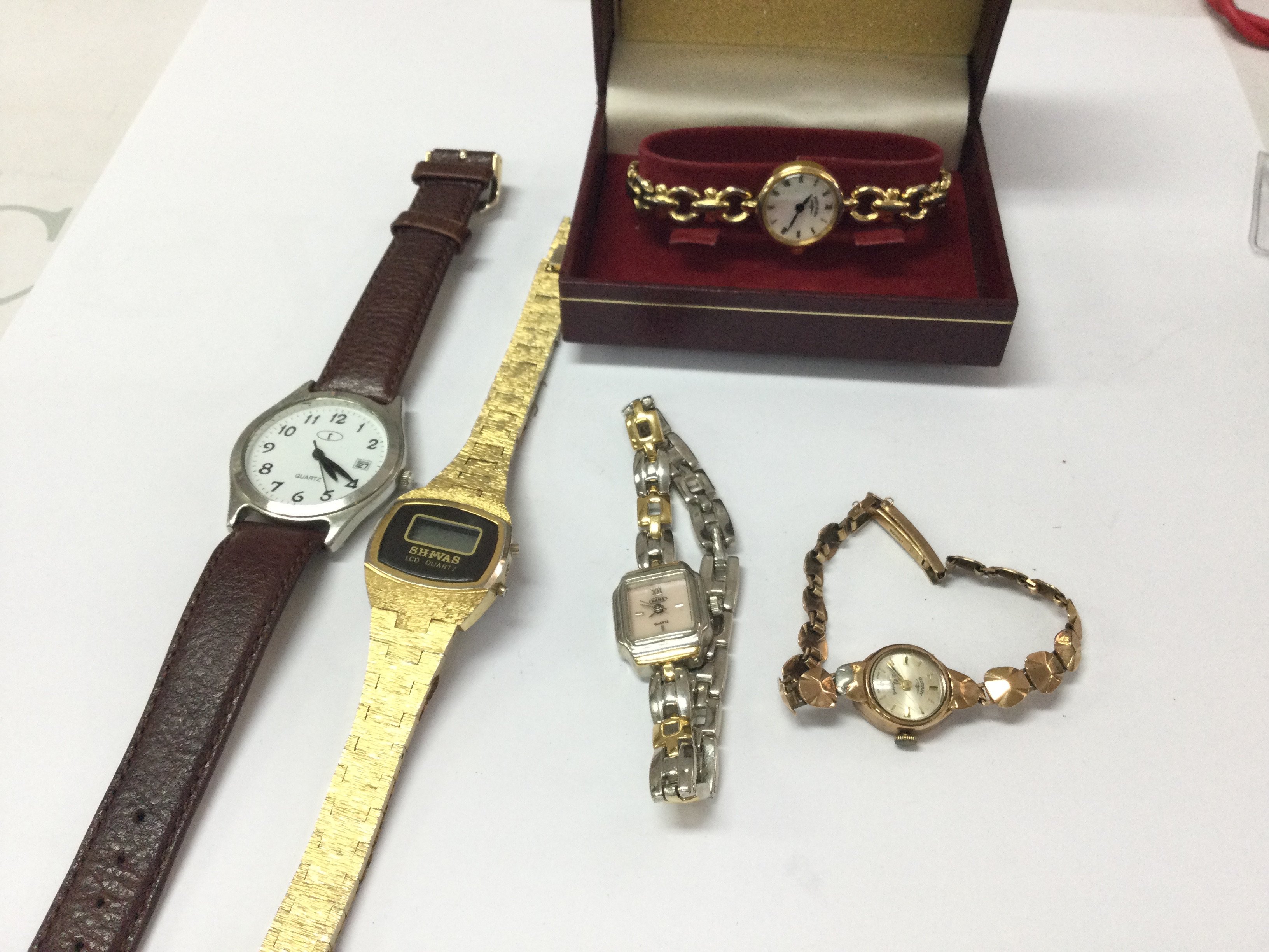 A collection of watches including a 9ct gold case and strap example 11.48g Postage B