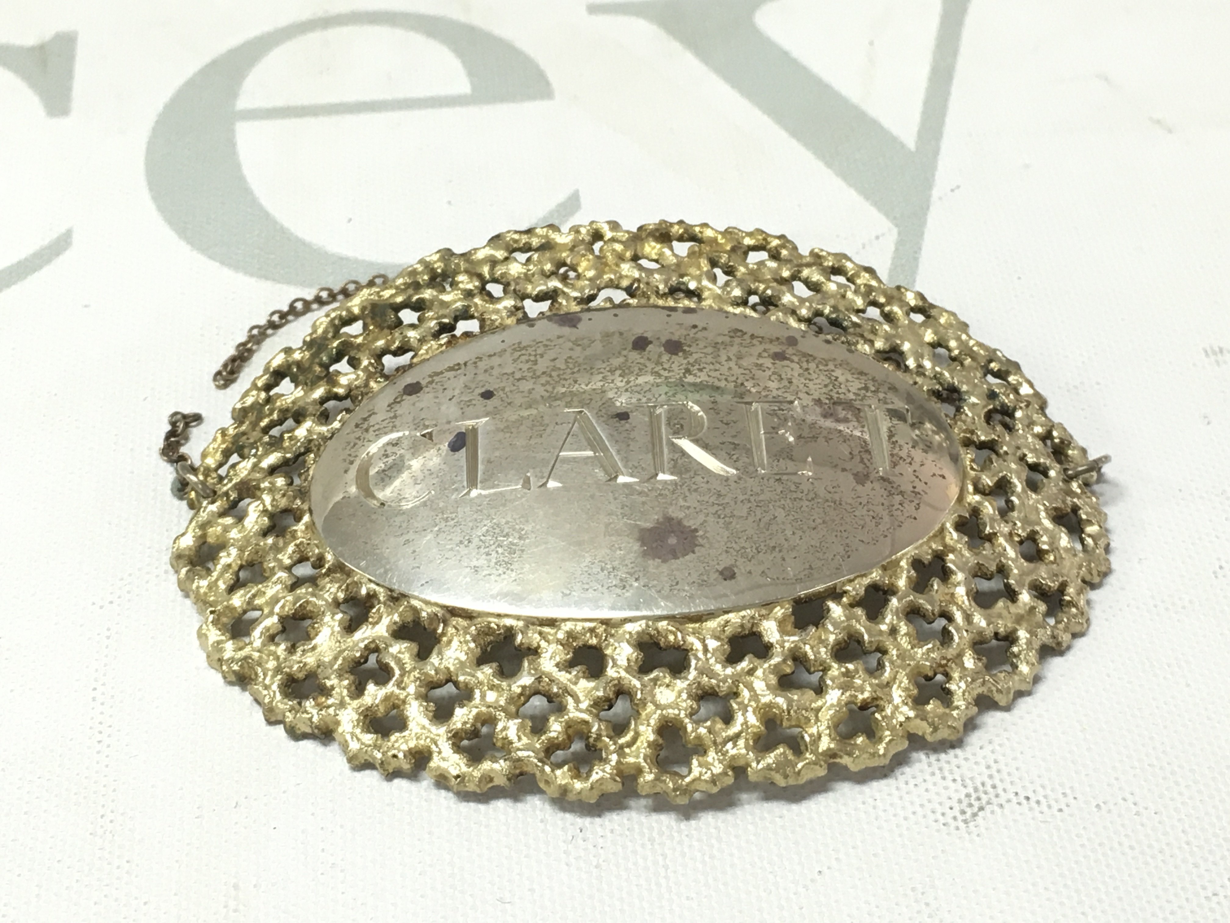 A silver claret decanter label by Stuart Devlin. Postage A