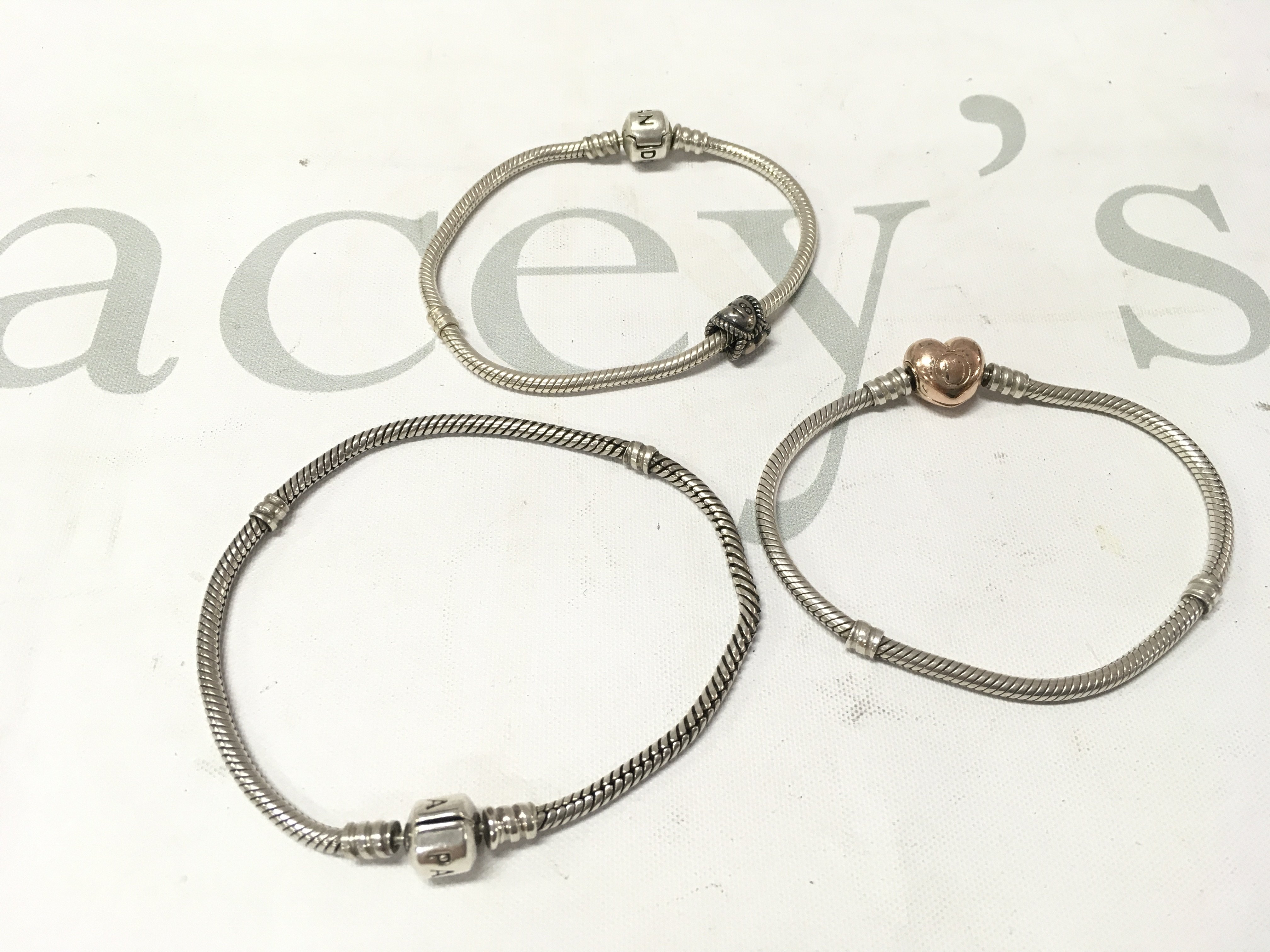 Three silver pandora bracelets. Postage A