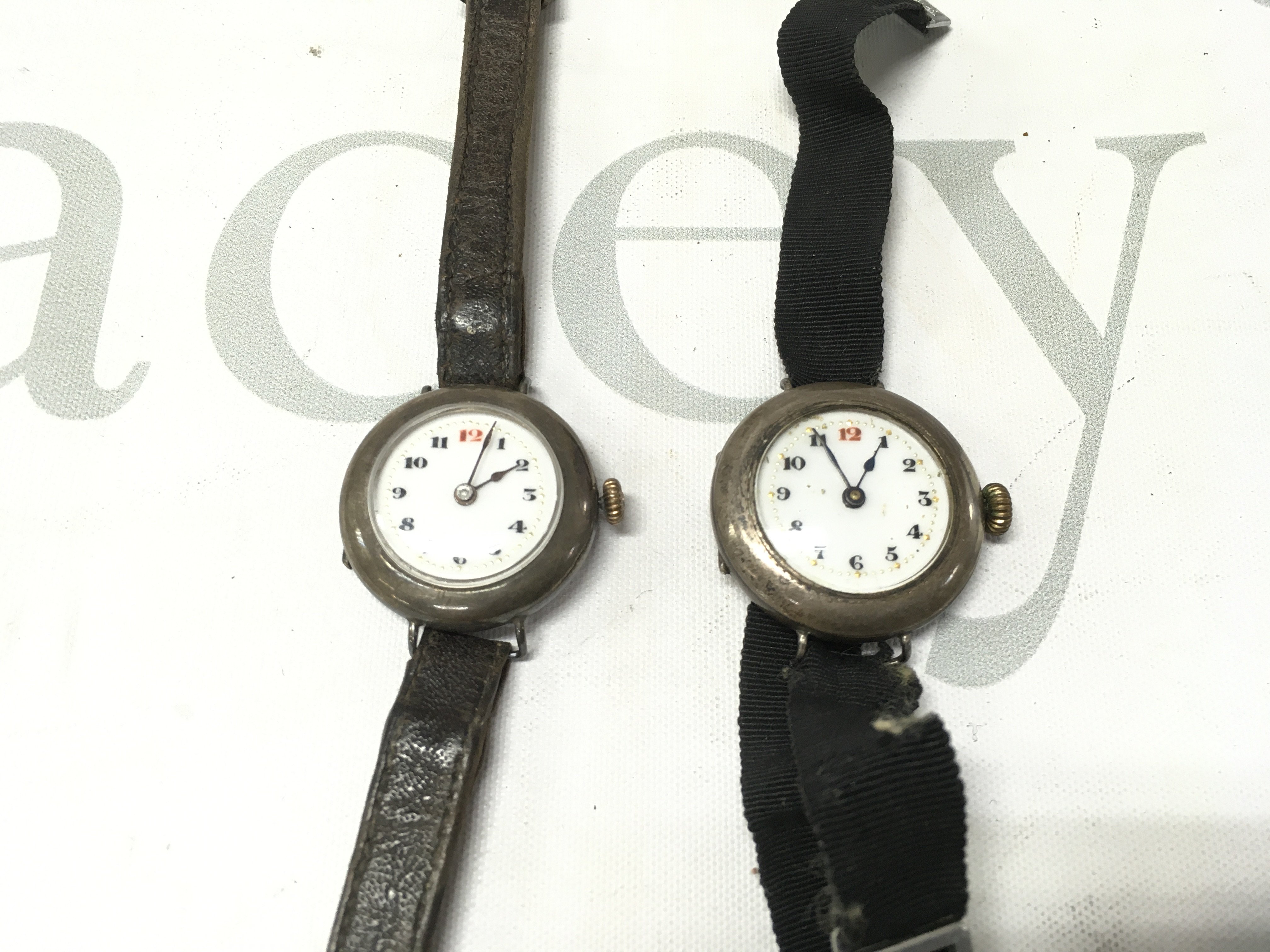 Two vintage silver cased watches. Postage B