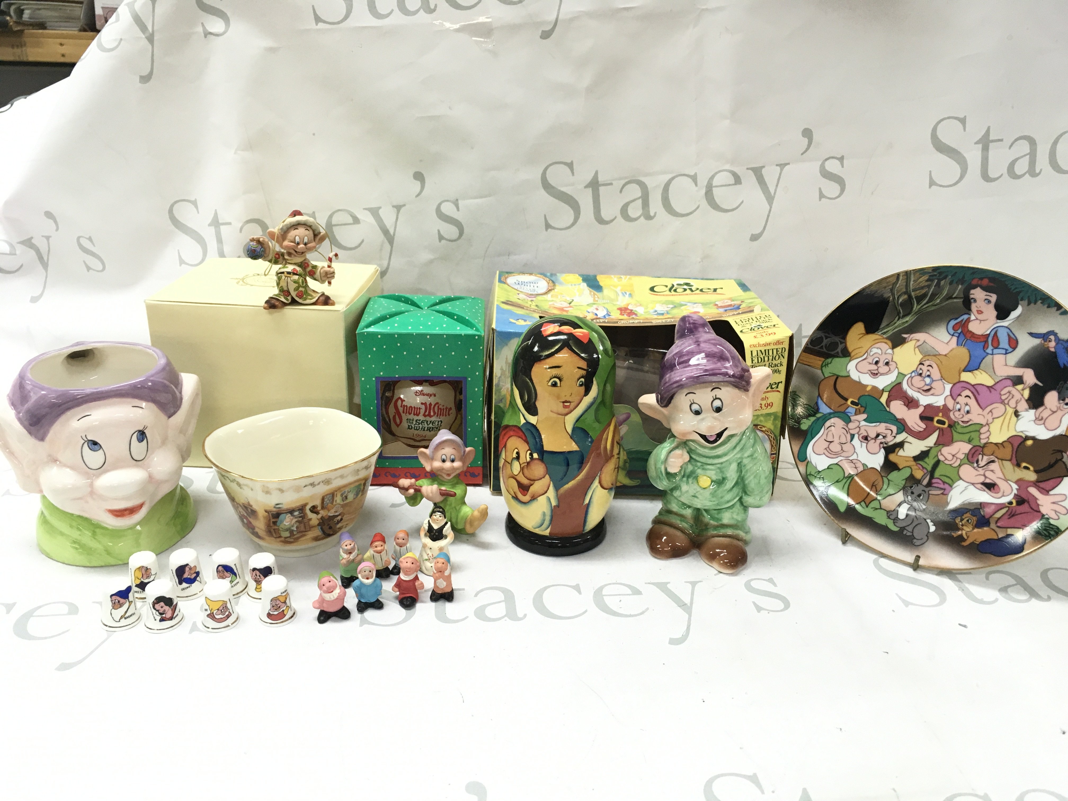 A collection of Disney Snow White items including a character jug, Kenleys plate, figurine, Lenox treat bowl, Christmas ornament figure , thimbles etc. this lot cannot be posted