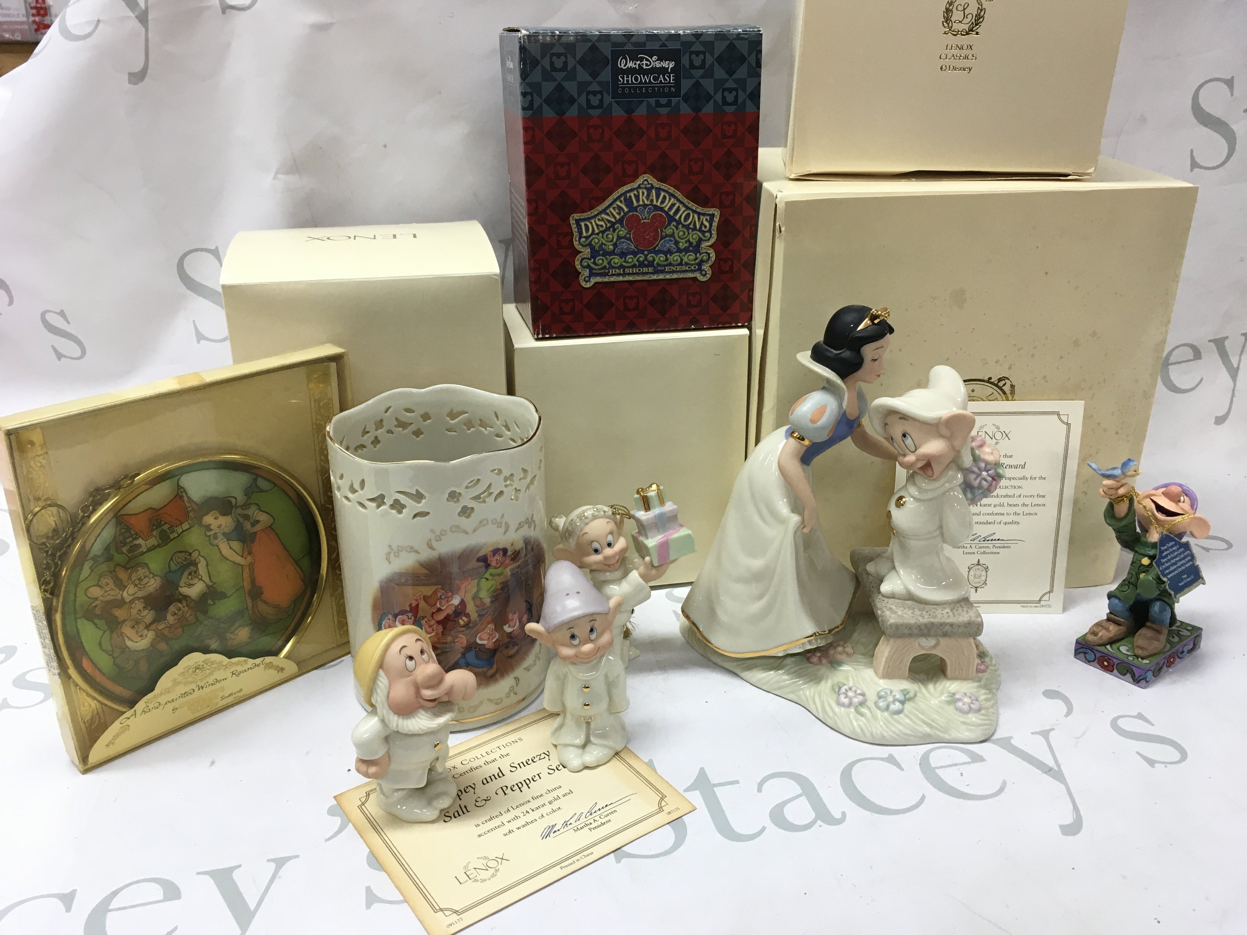 A collection of boxed Disney porcelain Lenox figures including Dopeys Sweet Reward, Dopey and Sneezy salt and pepper set , Dopey showcase , Votive vase