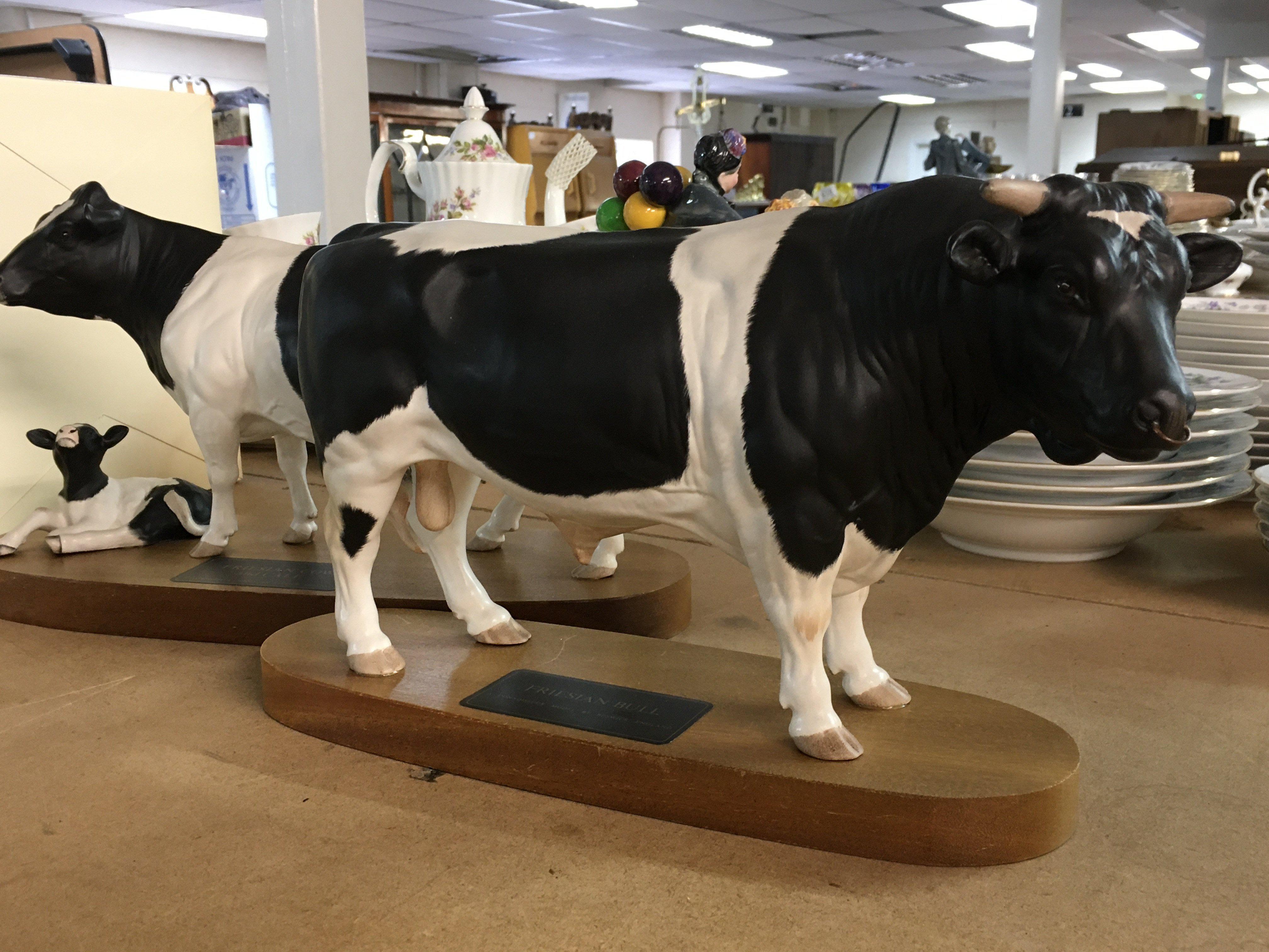 Beswick cow and calf and Friesian bull .