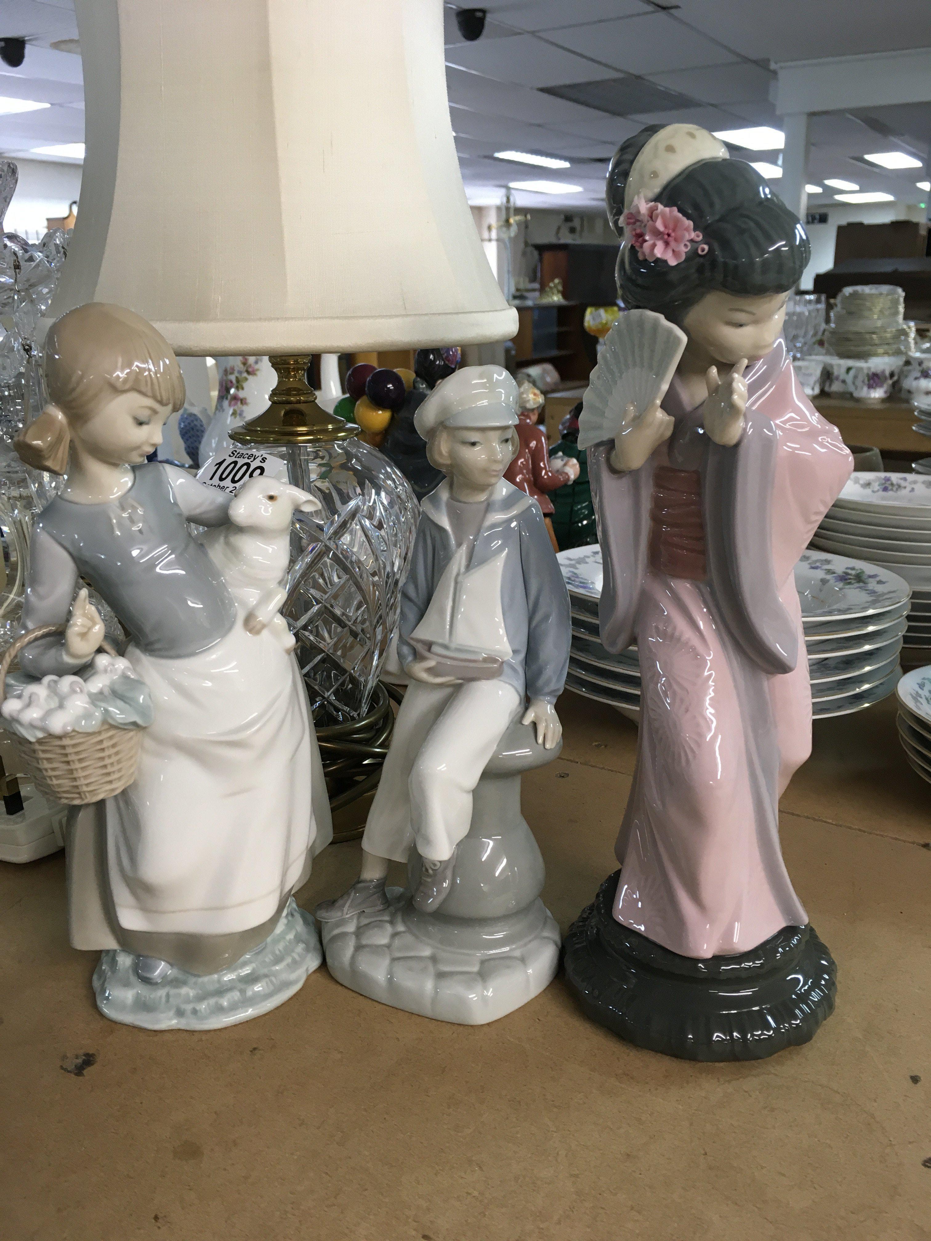 A Collection of three Lladro figures.