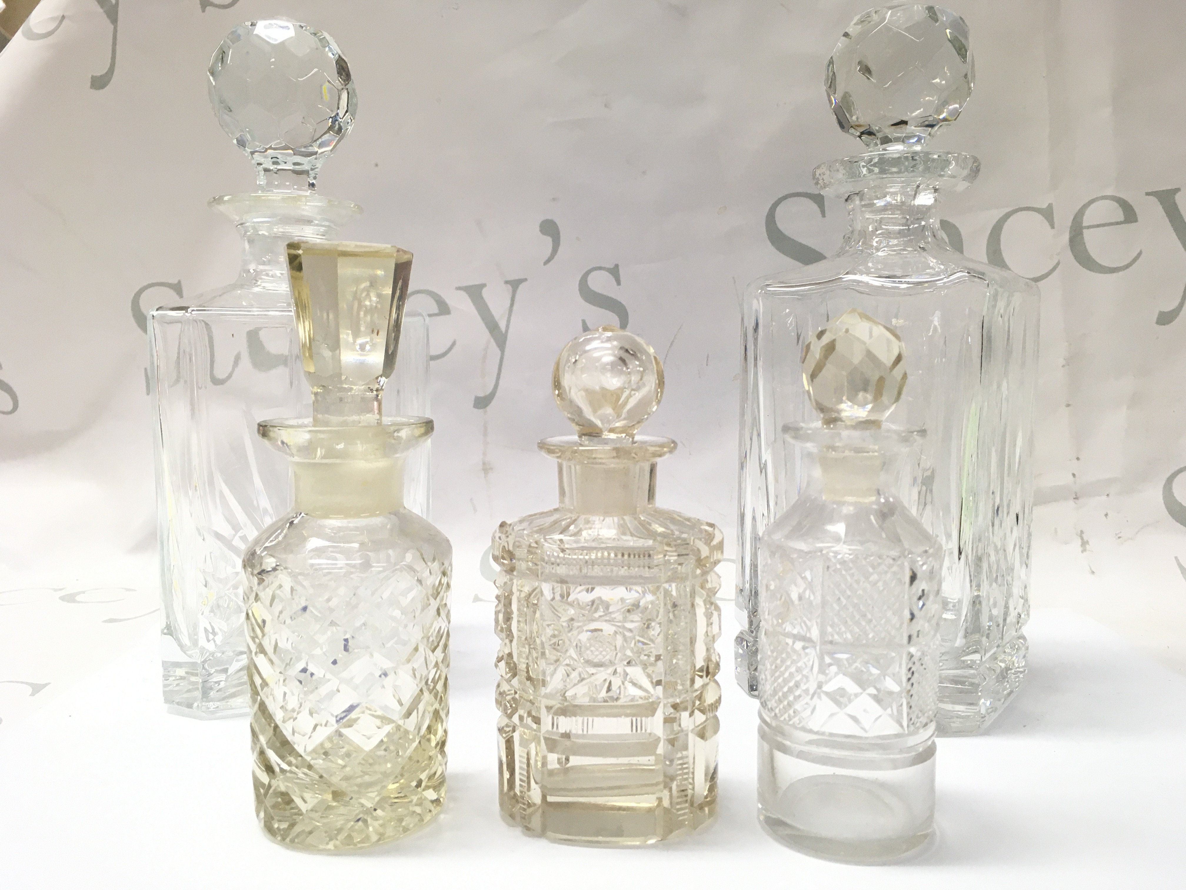 Two French decanters and three cut glass scent bottles . 14 to 26cm tall This lot cannot be posted