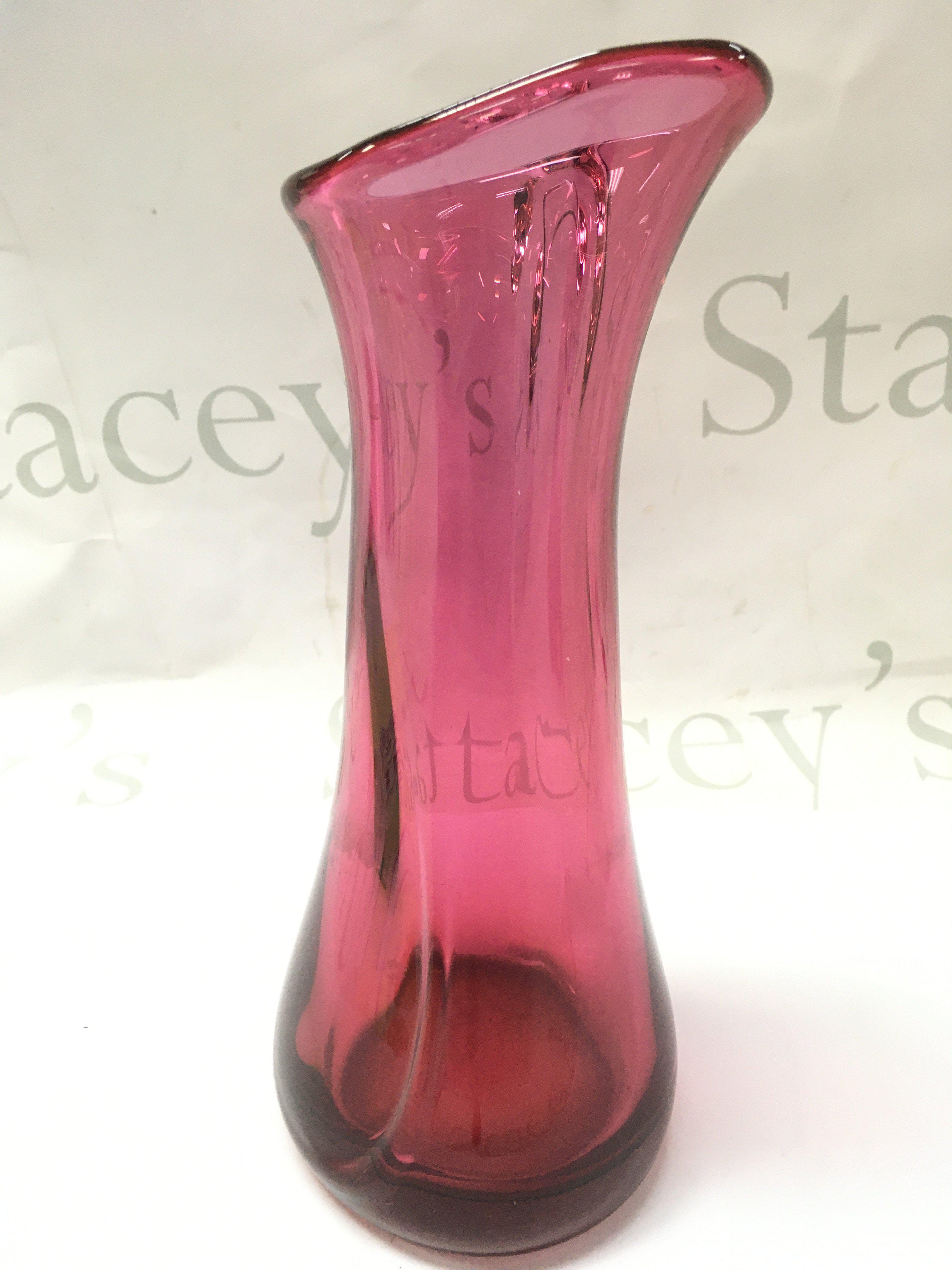 A cranberry heavy art glass vase , 28cm tall. This lot cannot be posted