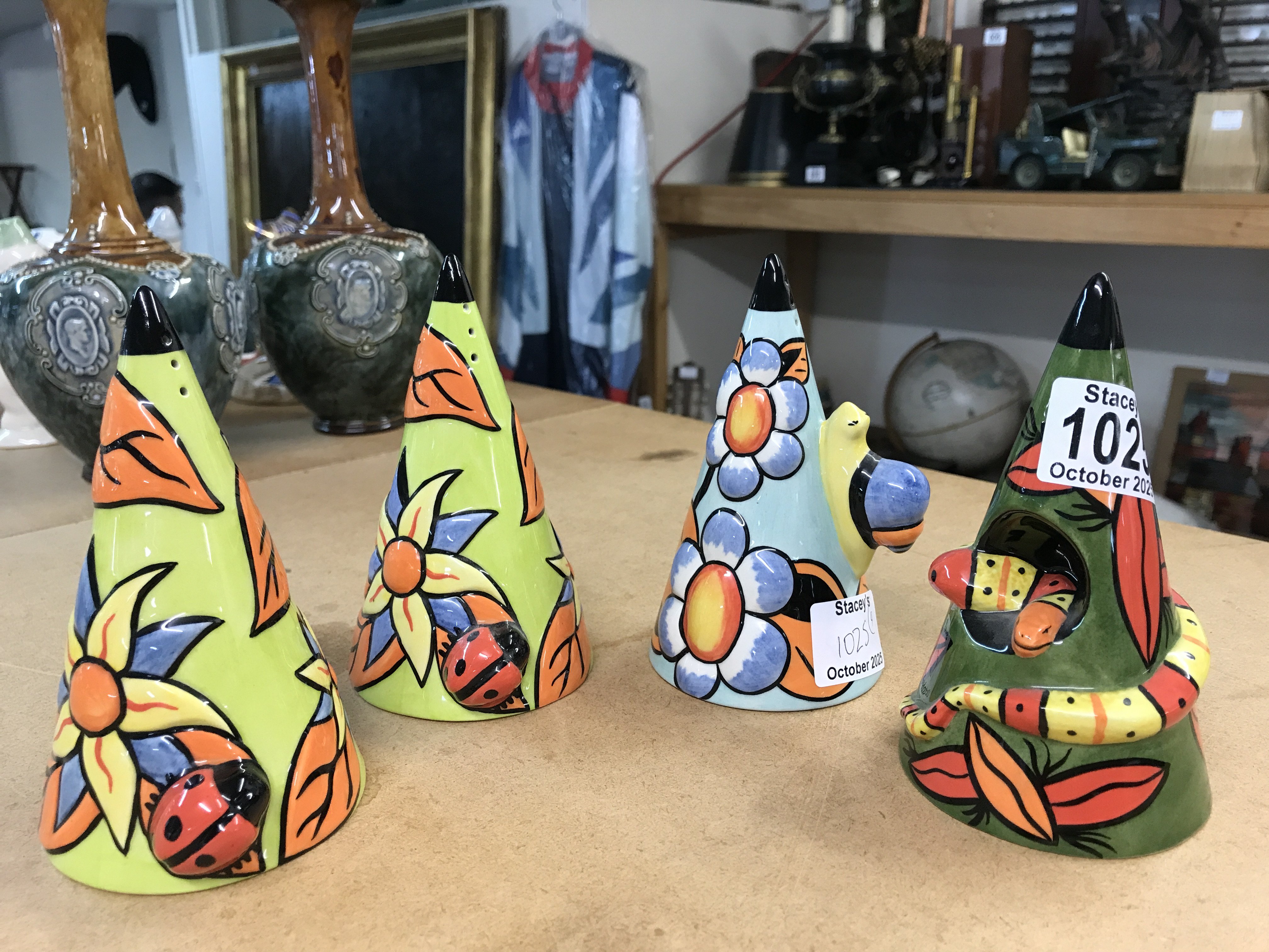 Four Lorna Bailey conical sugar shakers, including Limited Edition 118/250 = snake, 9th limited edition Snail, 6th limited edition Ladybird and one other ladybird shaker