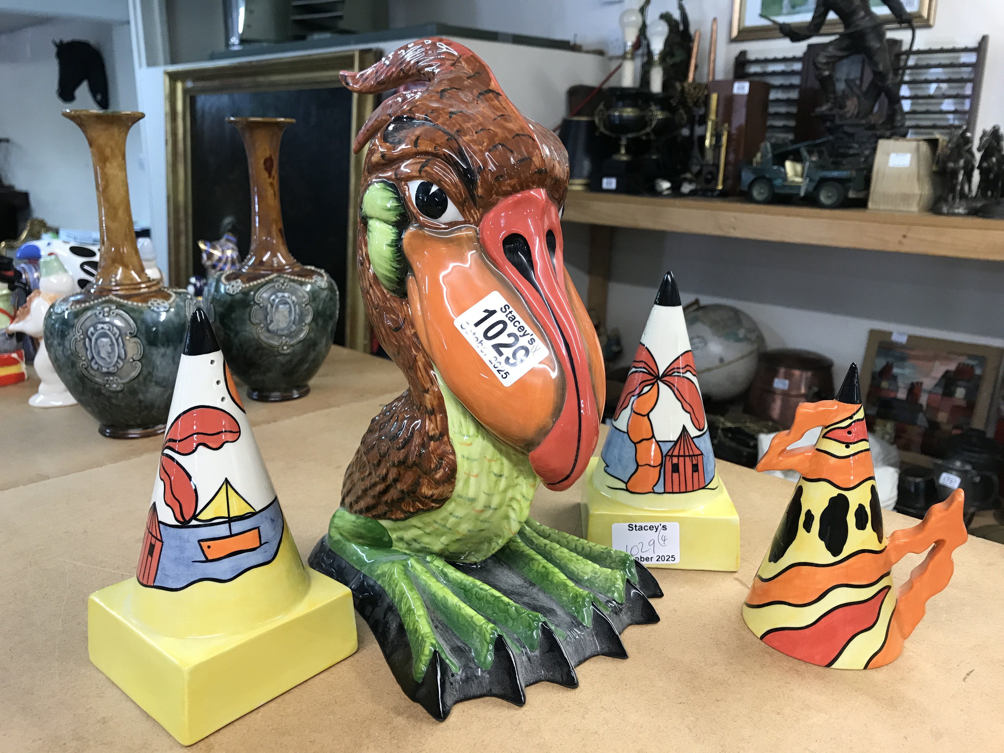 A Large Lorna Bailey Limited Edition bird 28/75; height 29cm, together with three Lorna Bailey sugar shakers to include- two in the Tropicana pattern and 5th Limited Edition Fire