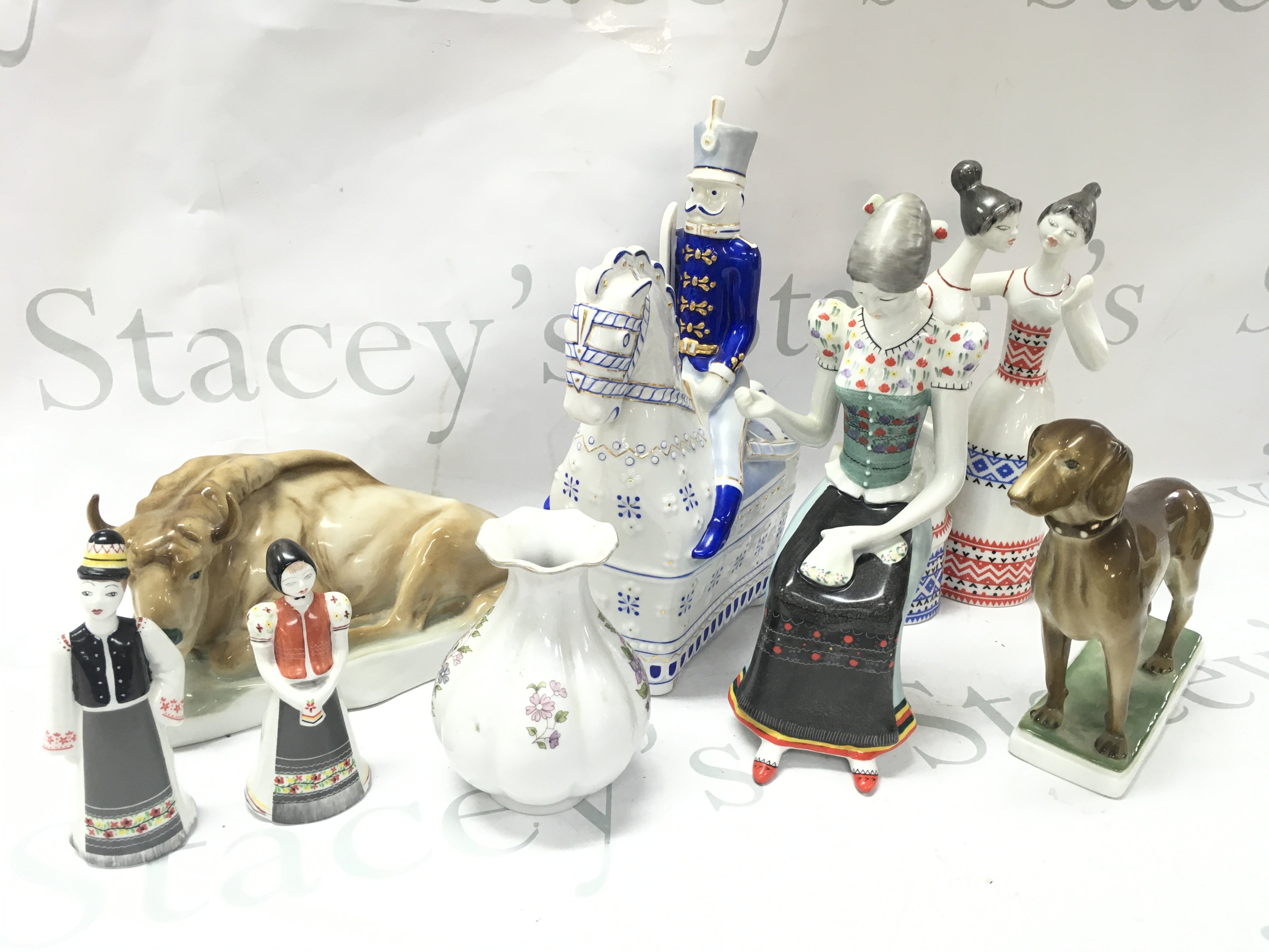 Hungarian Hollohaza and Zsolnay Pecs porcelain figures and a vase. Figures including soldier on horseback , dog figure, Needlewoman , Bison etc. this lot cannot be posted