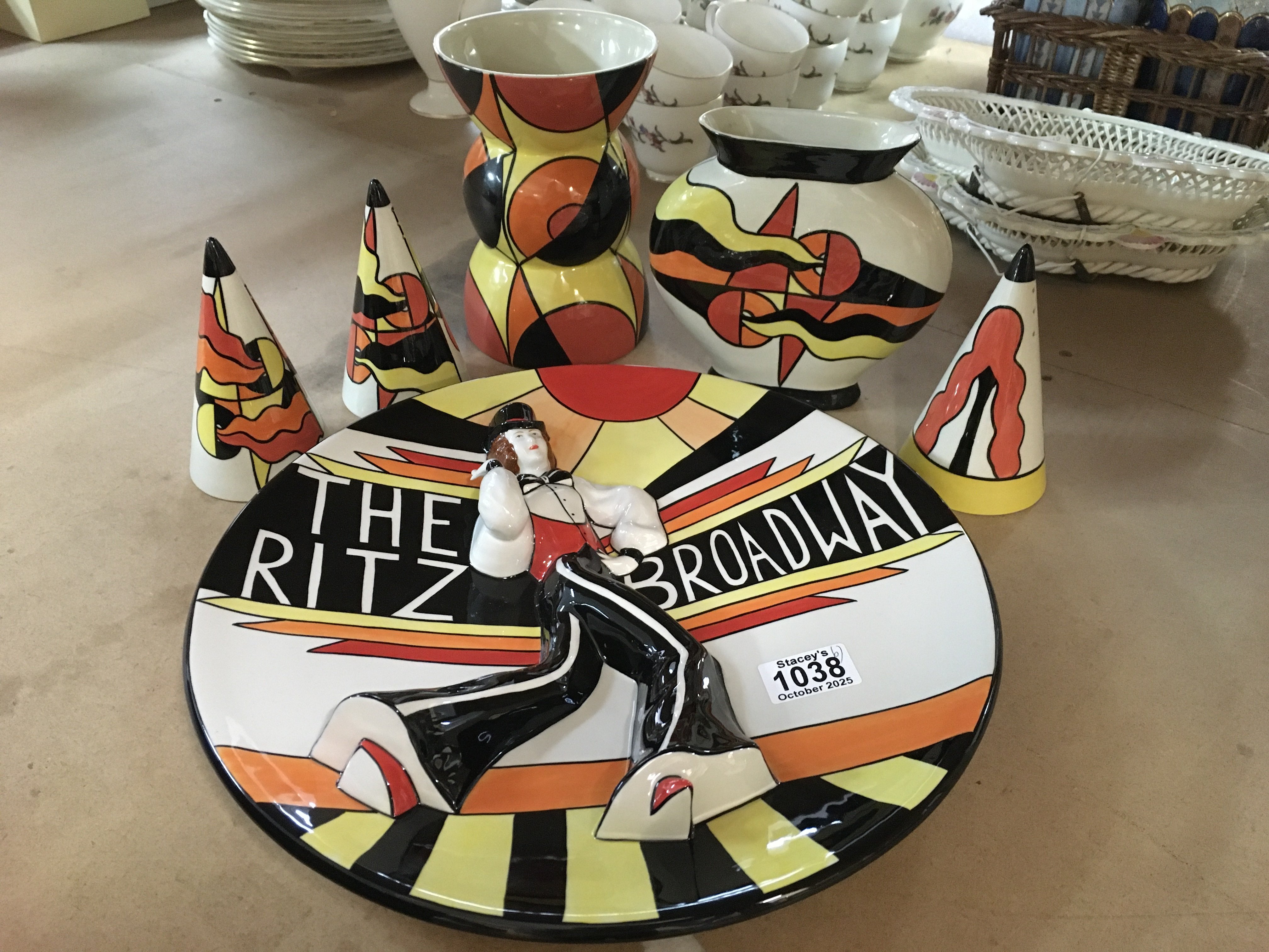 Six Lorna Bailey pottery pieces including "Ritz The Broadway"- Deco Lady charger Ginger (limited edition 50/100 , with certificate of authenticity), together with sugar shakers in the Mirage colour way and two vases