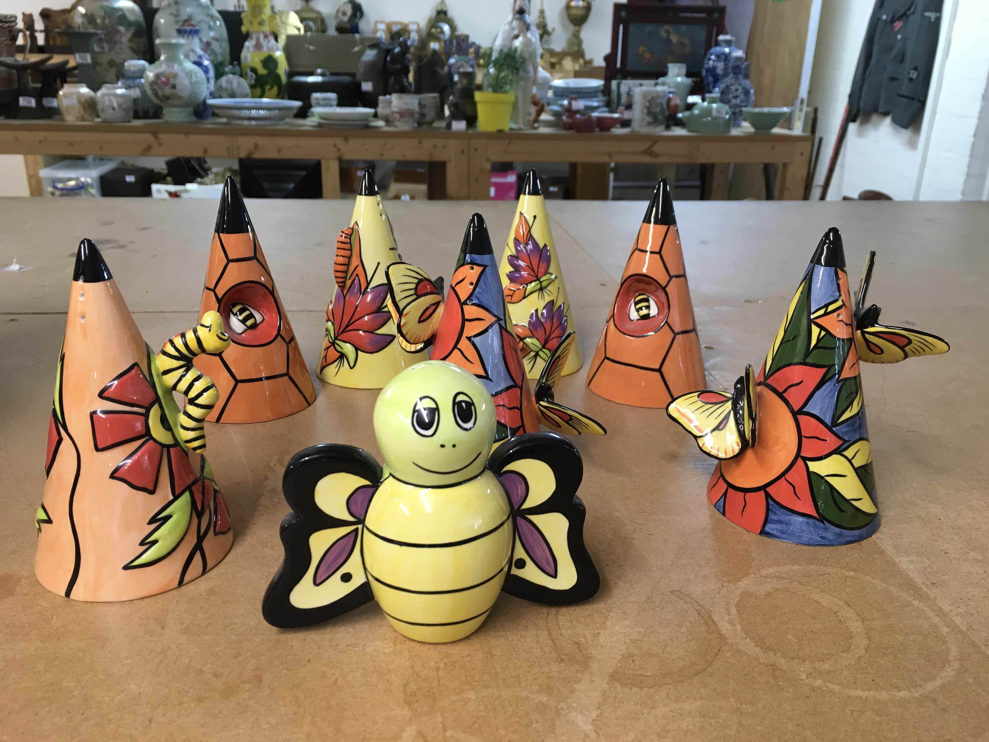 Six Lorna Bailey insect themed Sugar shakers, together with a Bee shaped one