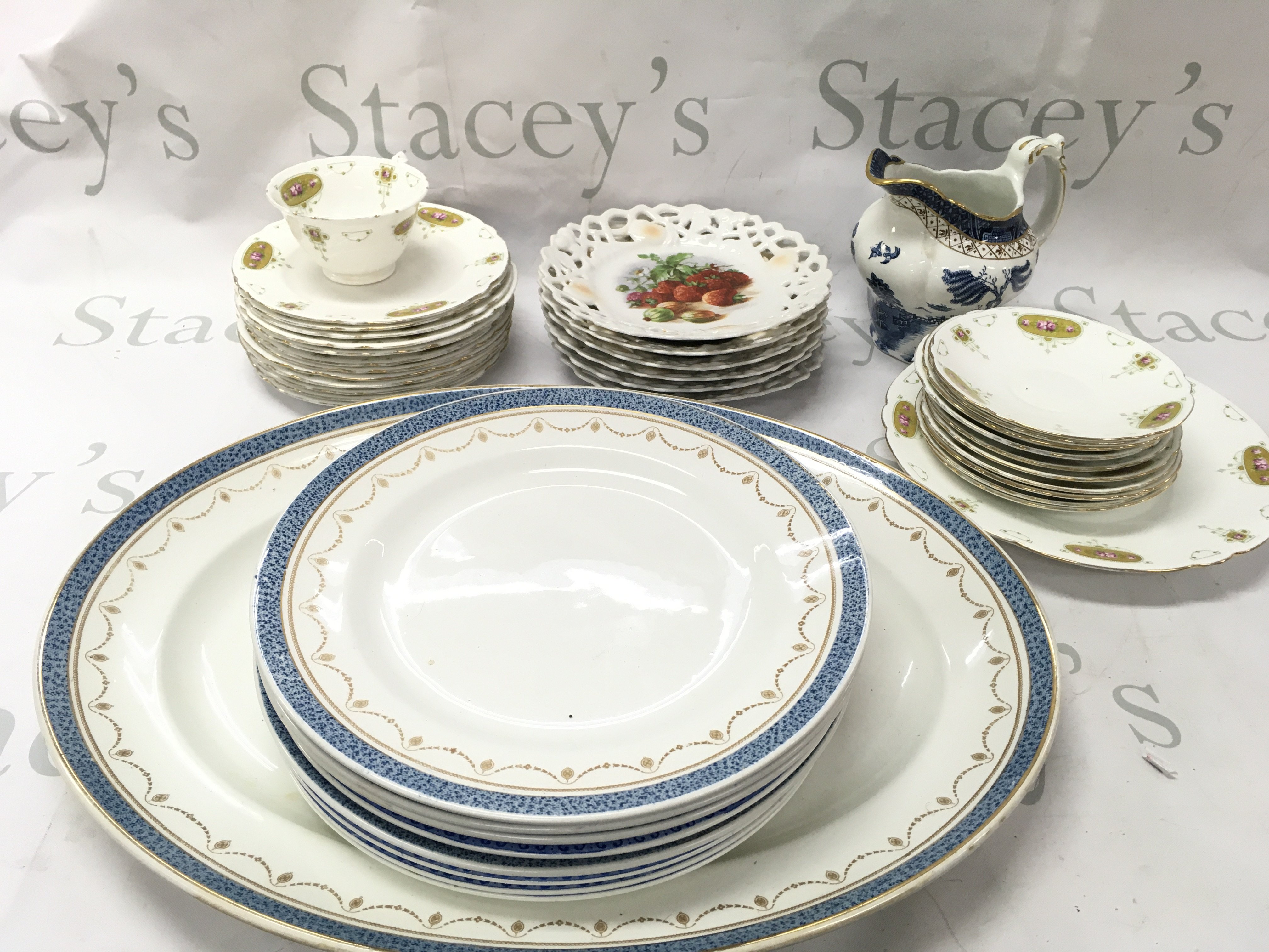 A Collection of ceramics including Alfred B Pearce plates and a platter, Late Foley Shelley Rose saucers, cup, plates, German plates with various designs, Booths jug . This lot cannot be posted