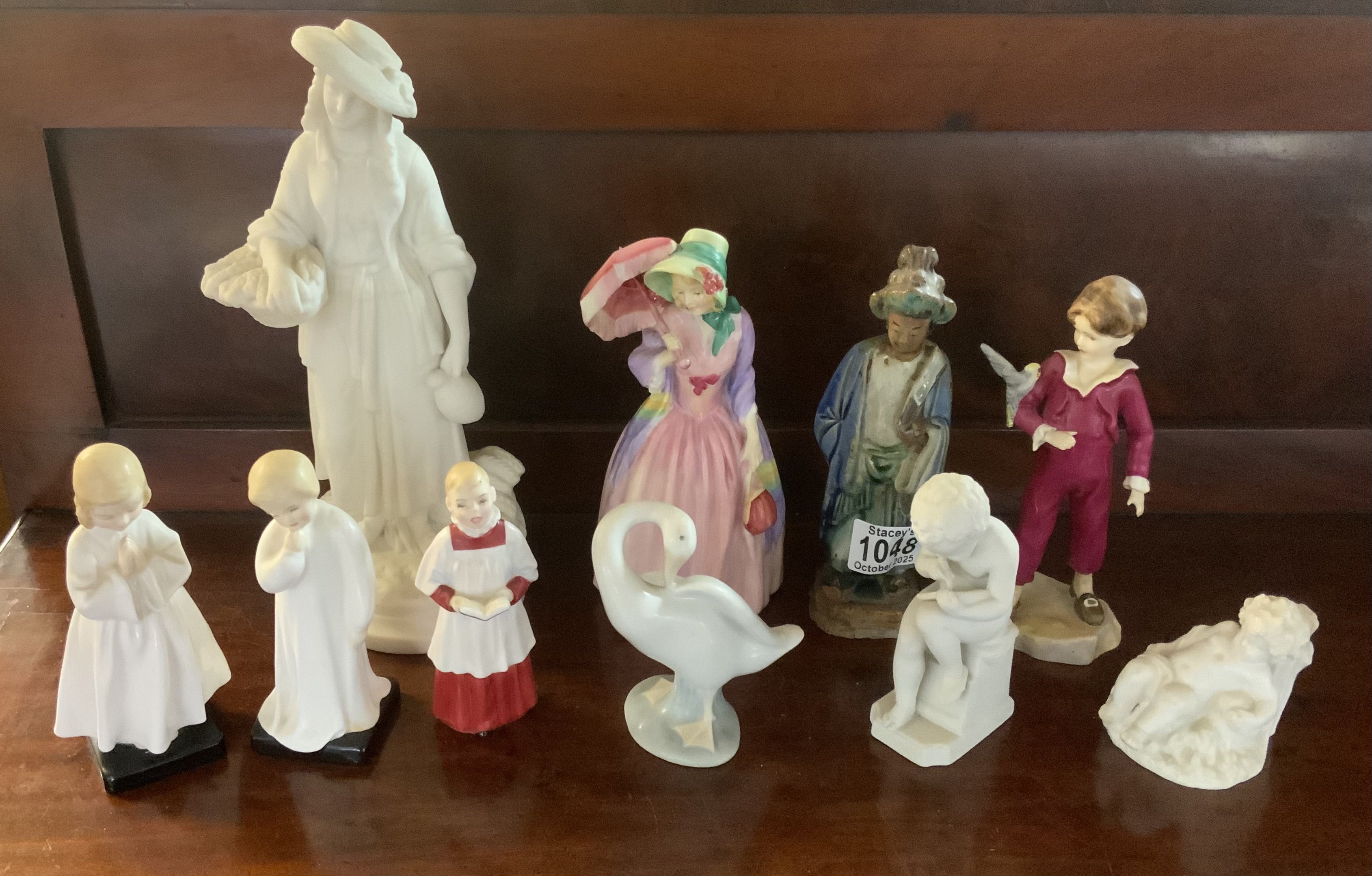 A small collection of porcelain figurines to include Worcester, Doulton Lladro etc.