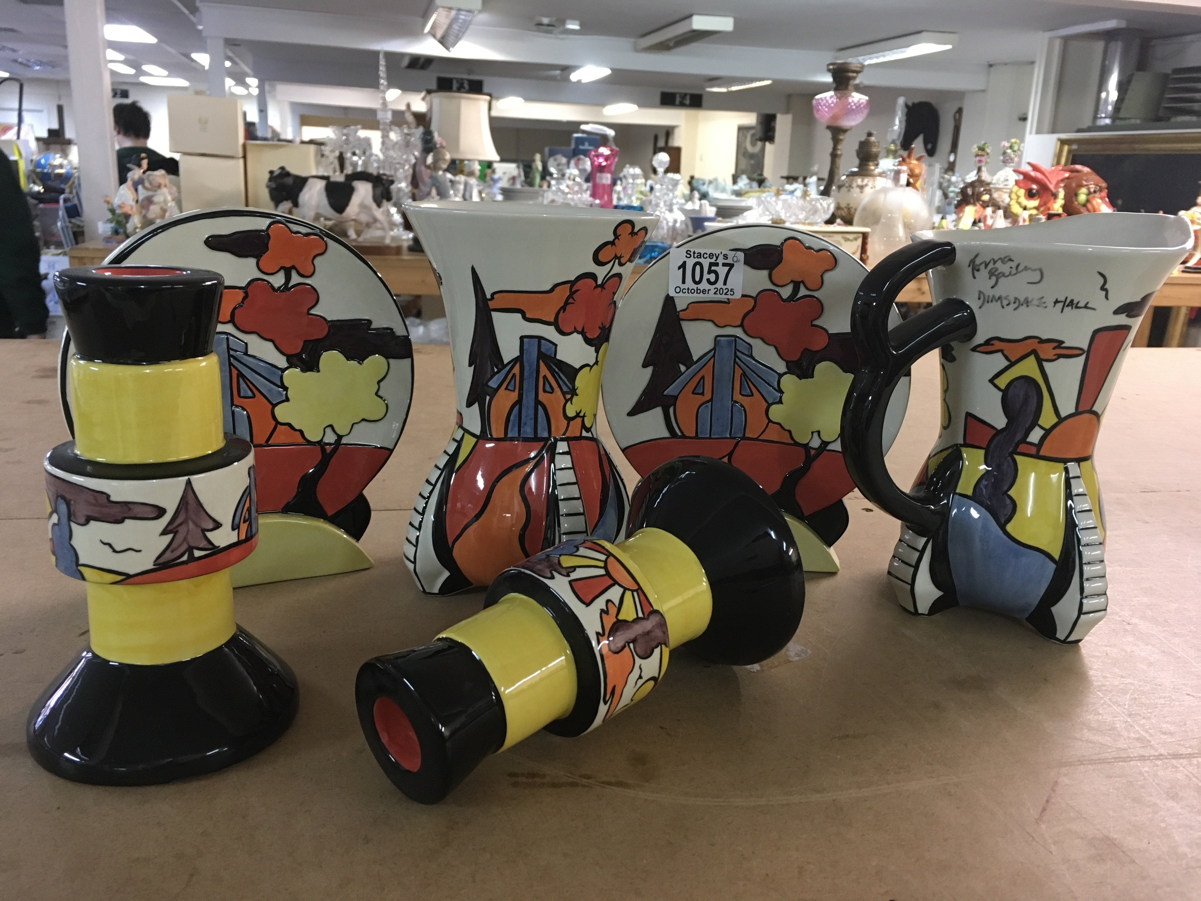 Six pieces of Lorna Bailey pottery in the &#2013266057&#2013265947&#2013265935Dimsdale Hall&#2013266057۝ pattern, including pair of flat backs , a vase, jug and and a pair of candlesticks