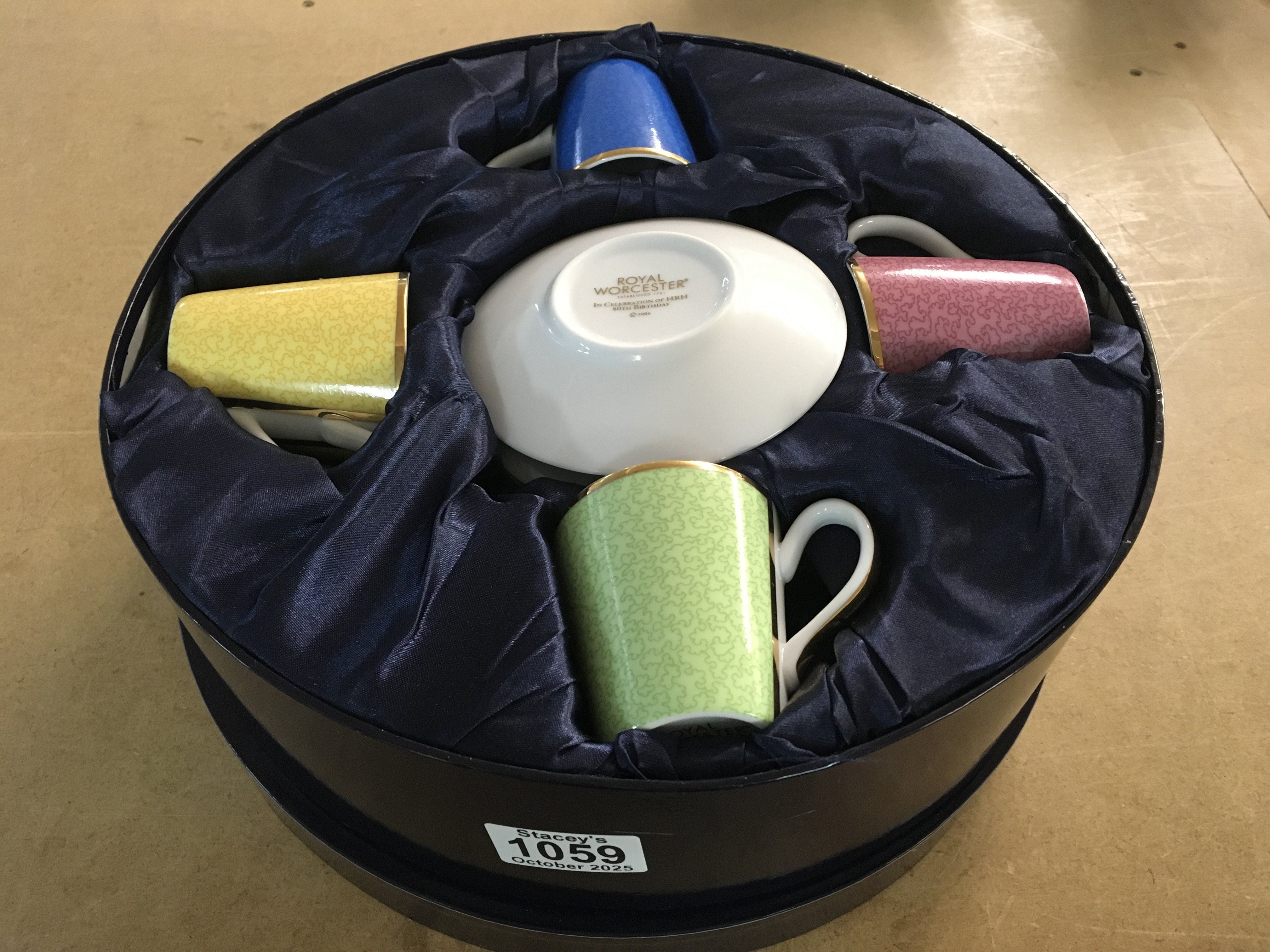 A Royal Worcester cup and saucer set, in fitted box, to commemorate HRH 80th birthday