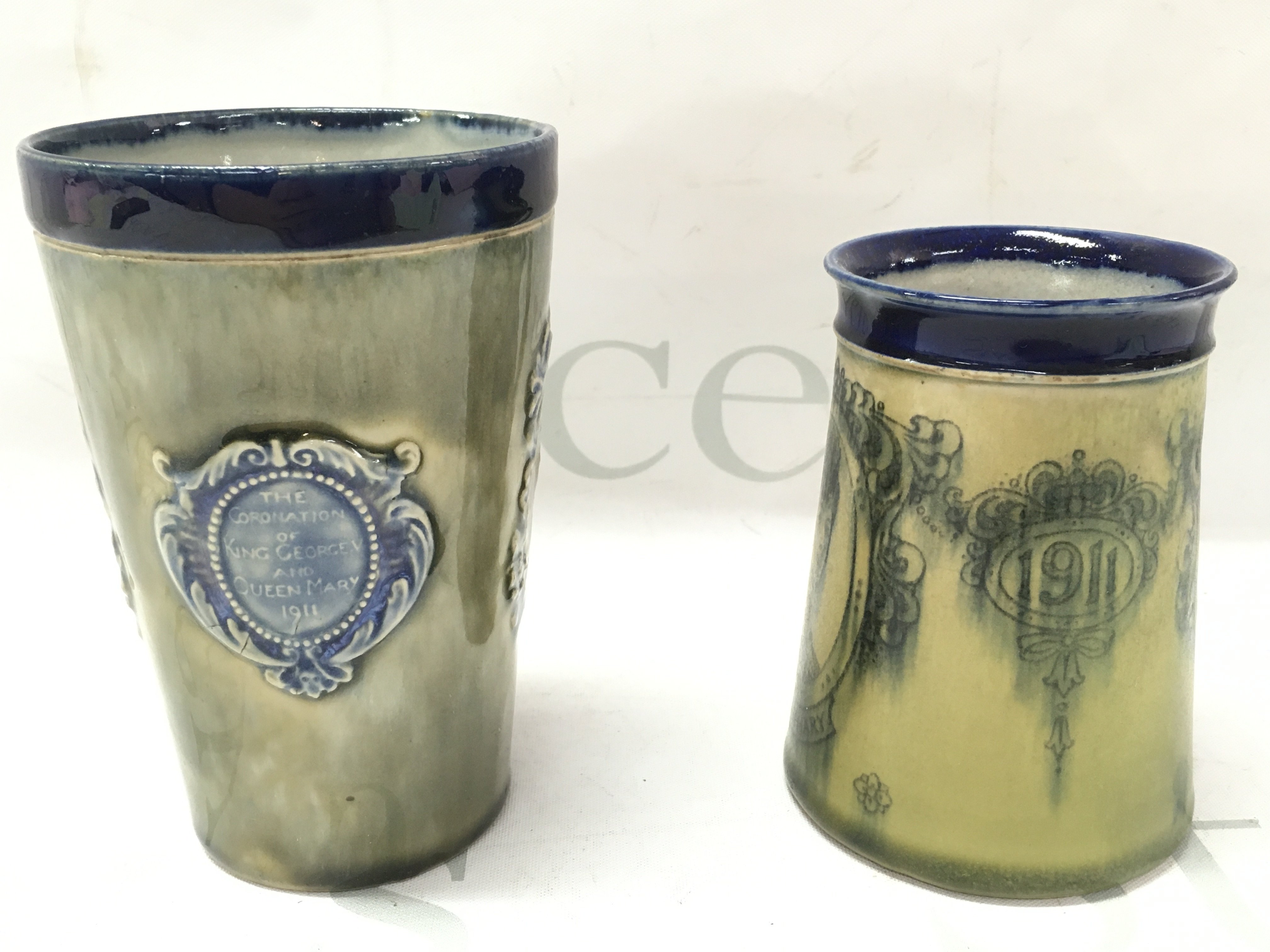 Royal Doulton 1911 Coronation cup and mug. 12.5cm tall 10cm tall. This lot cannot be posted