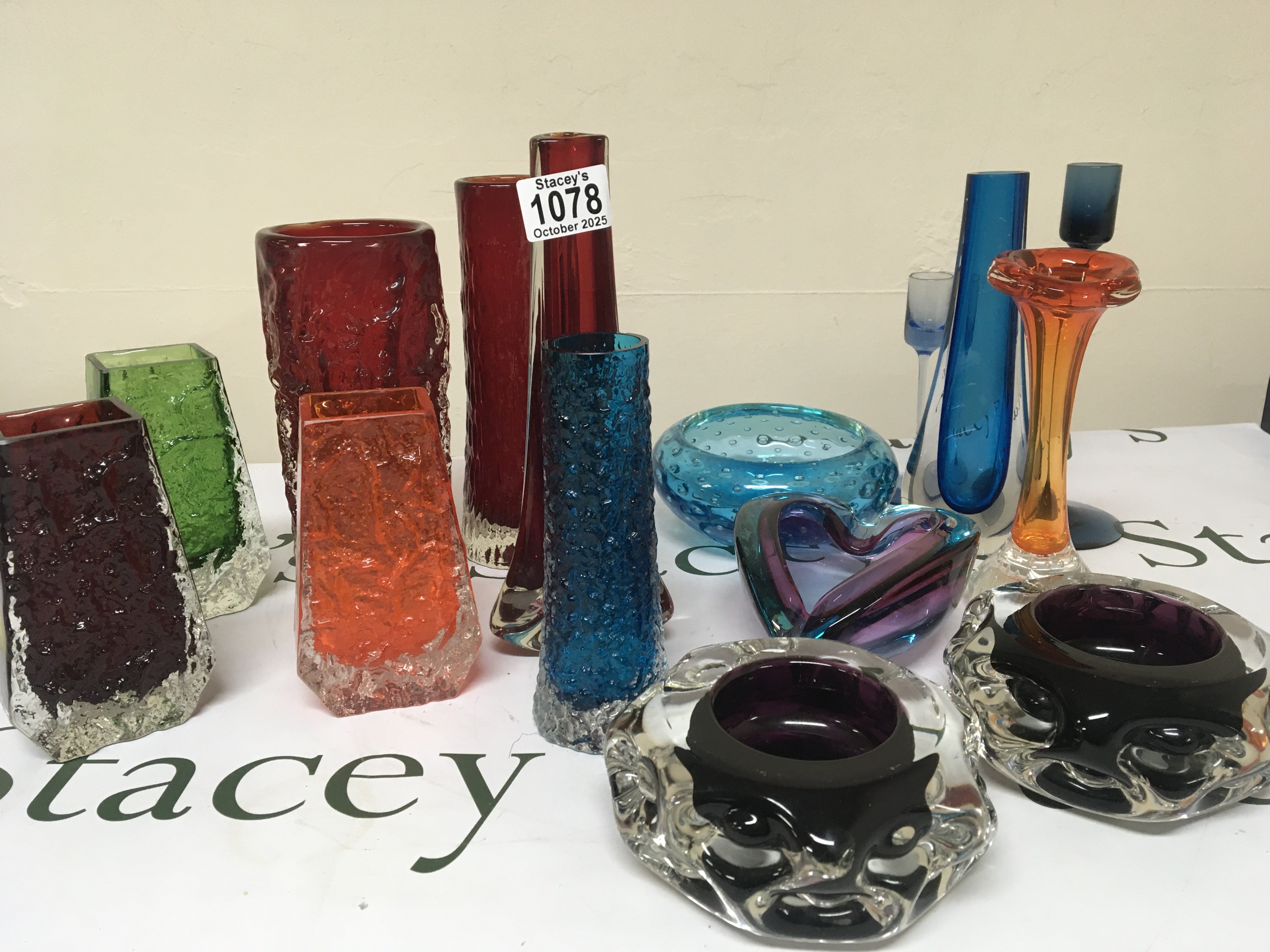 A collection of 1950-60 Whitefriars glass vases mixed colour and shape and other conforming glass dishes no obvious damage.