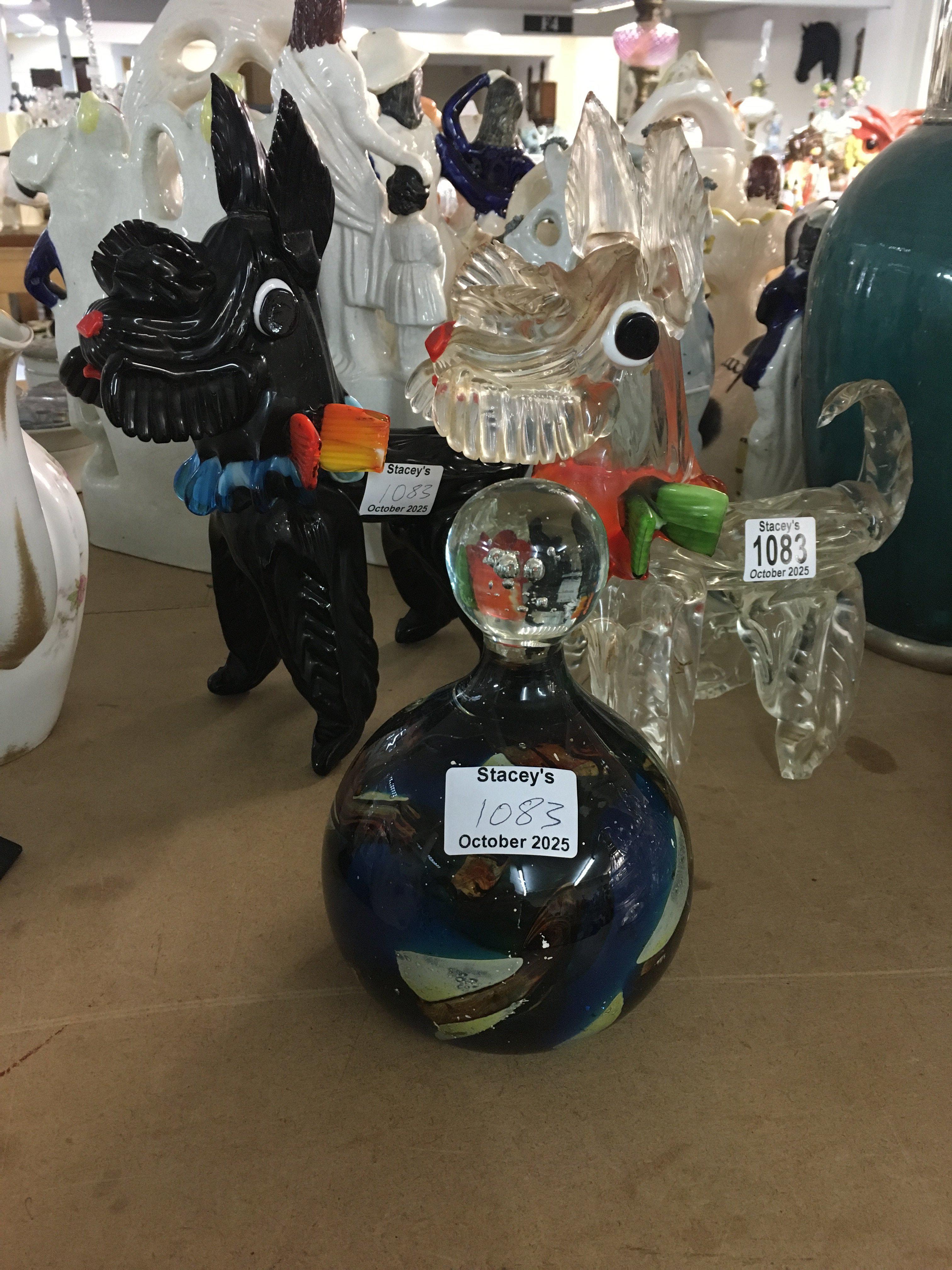 A pair of Murano glassware dogs and a mdina paper weight