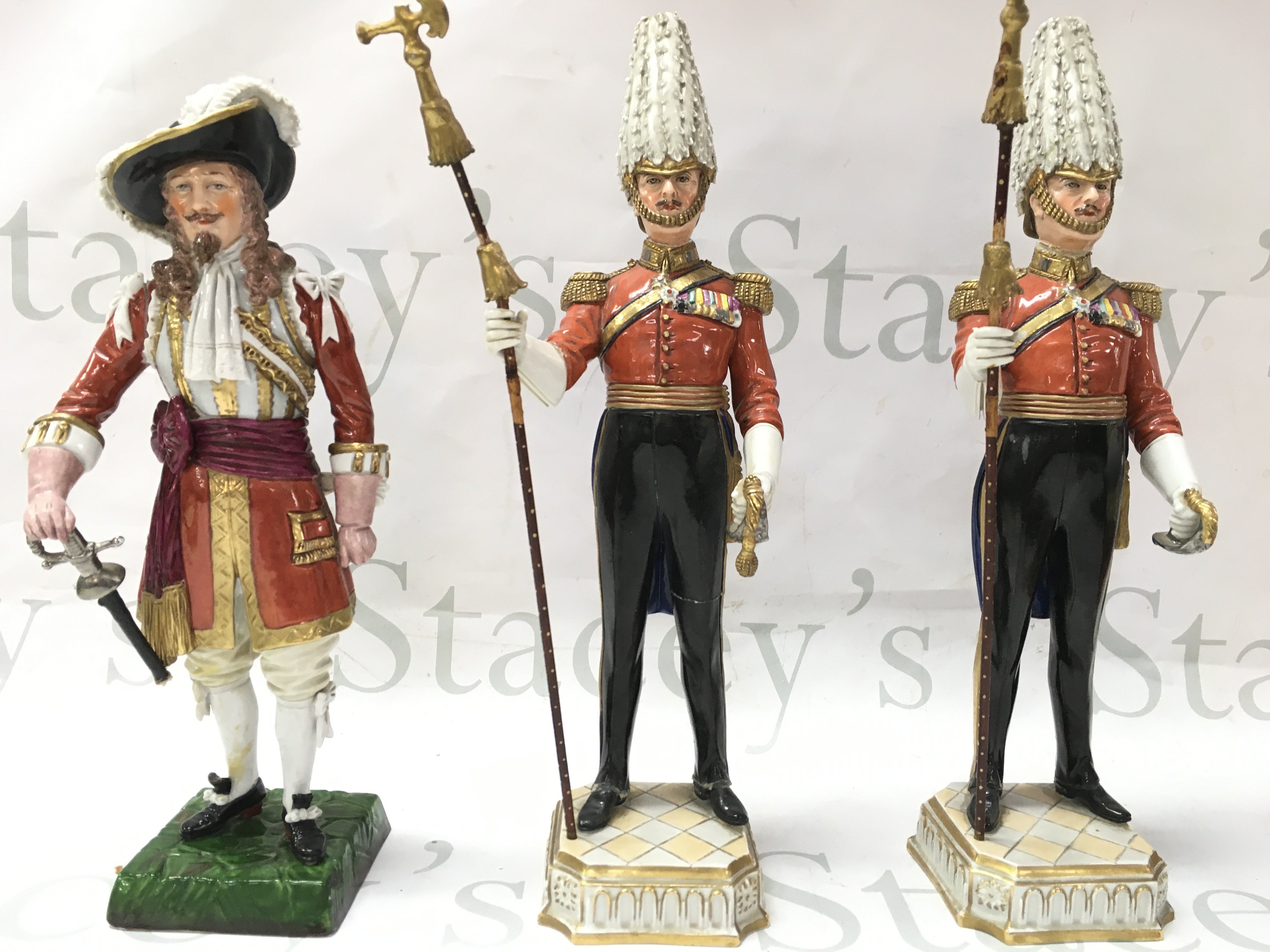 Three dresden early 20th century soldier figures.