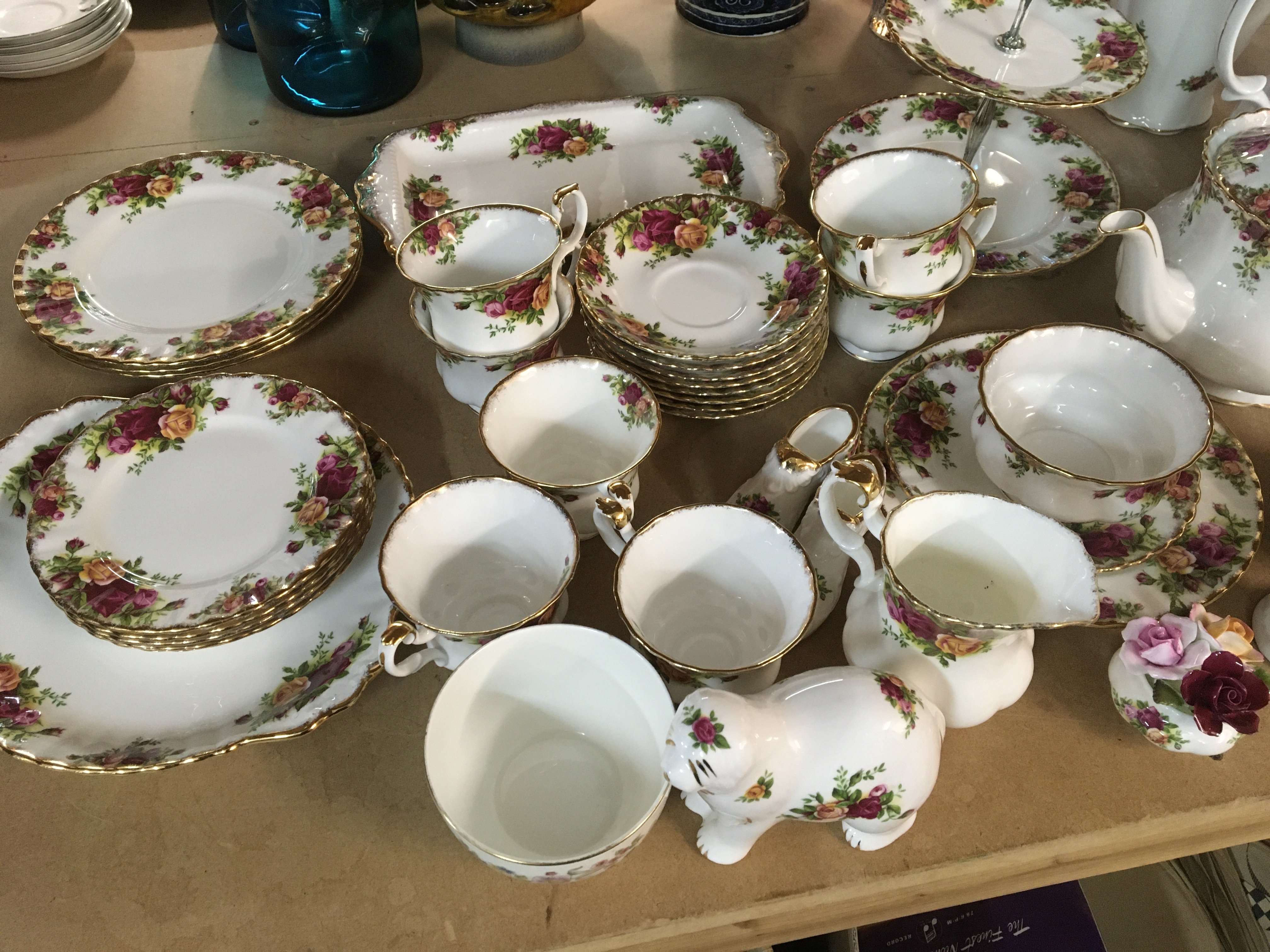 A Royal Albert tea and part dinner service tea pot coffee pot plates a two tier cake stand vase and other Royal Albert ornaments. No Obvious damage.