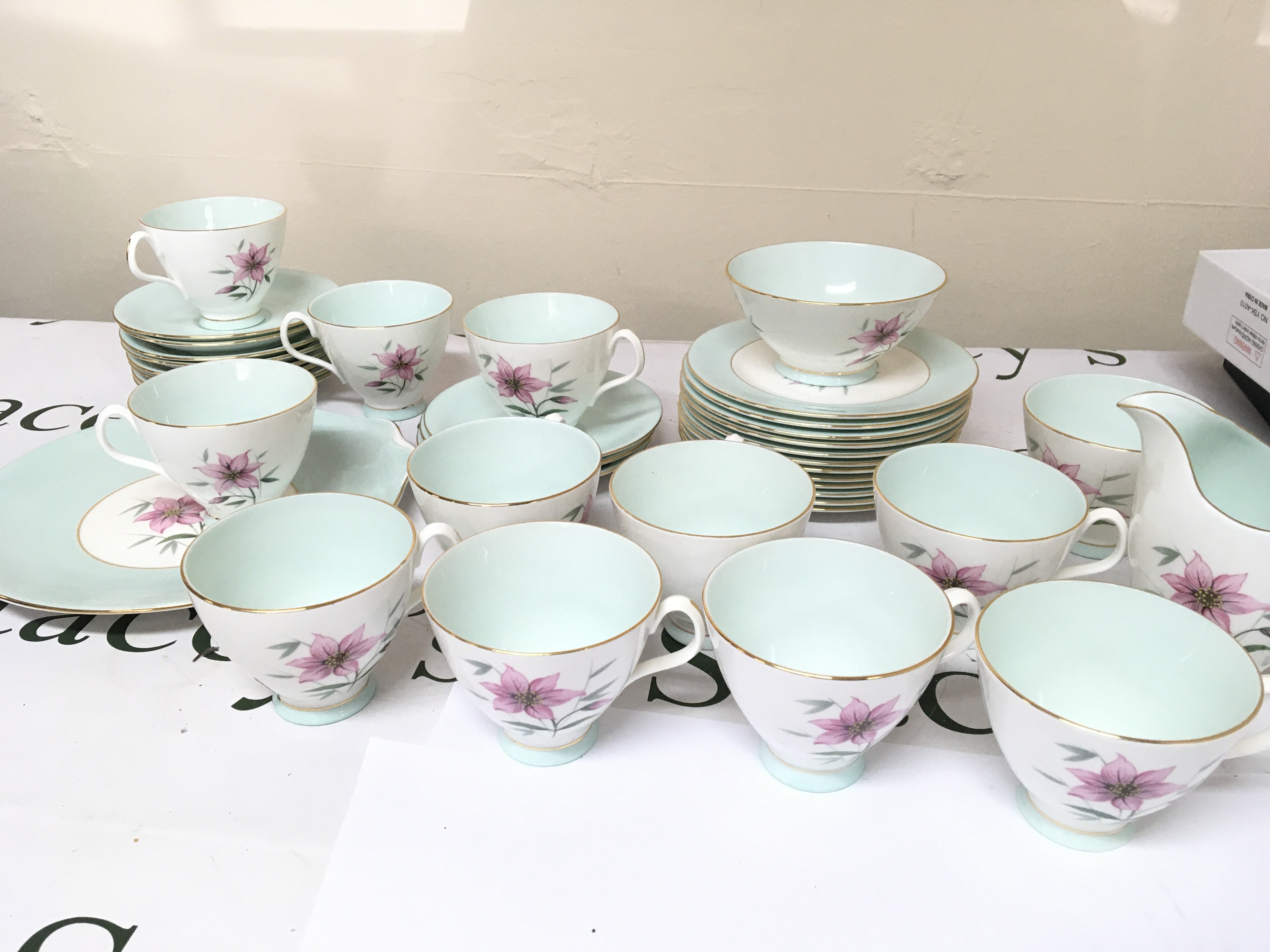 A Quality Royal Albert Bone China twelve place setting British tea set The Elfin pattern cups saucers side plates serving plate sugar bowl and cream jug. No Obvious Damage very good condition.