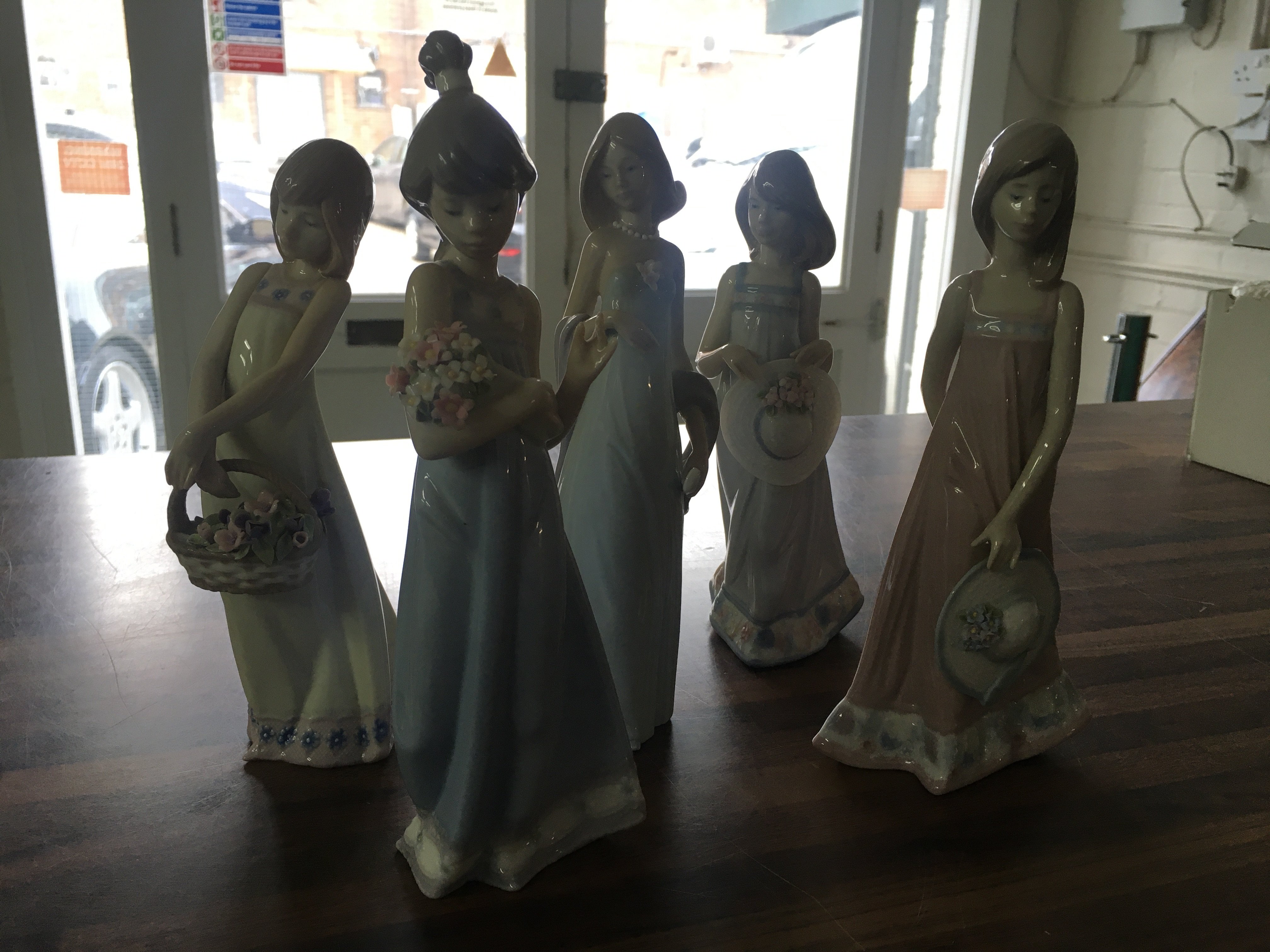 Five Lladro figures of maidens with flowers